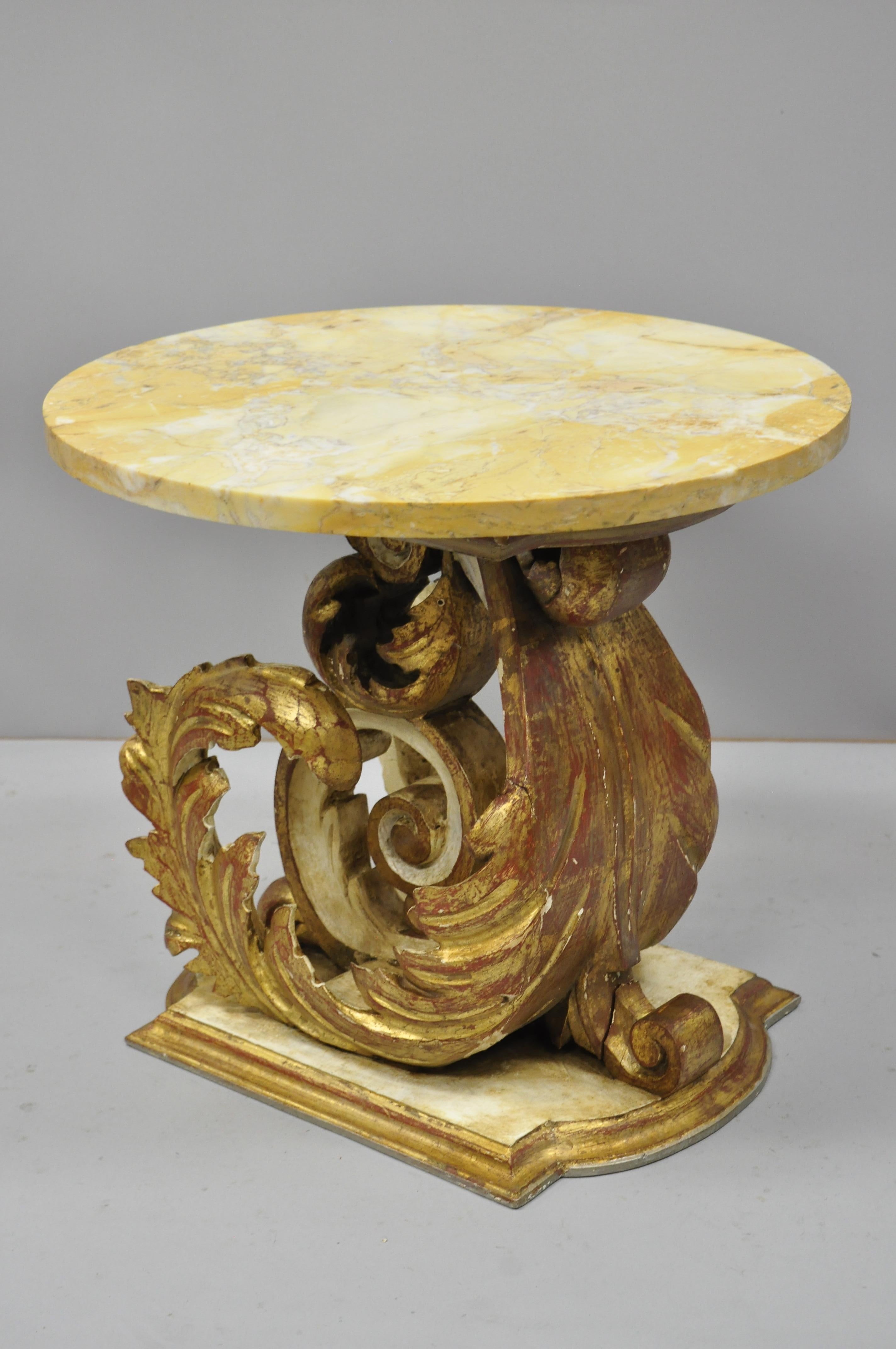 Italian neoclassical style round marble-top giltwood floral scroll accent side table. Item features solid carved and parcel giltwood base, round marble top, leafy floral scroll design, great style and form, circa early to mid-20th century.