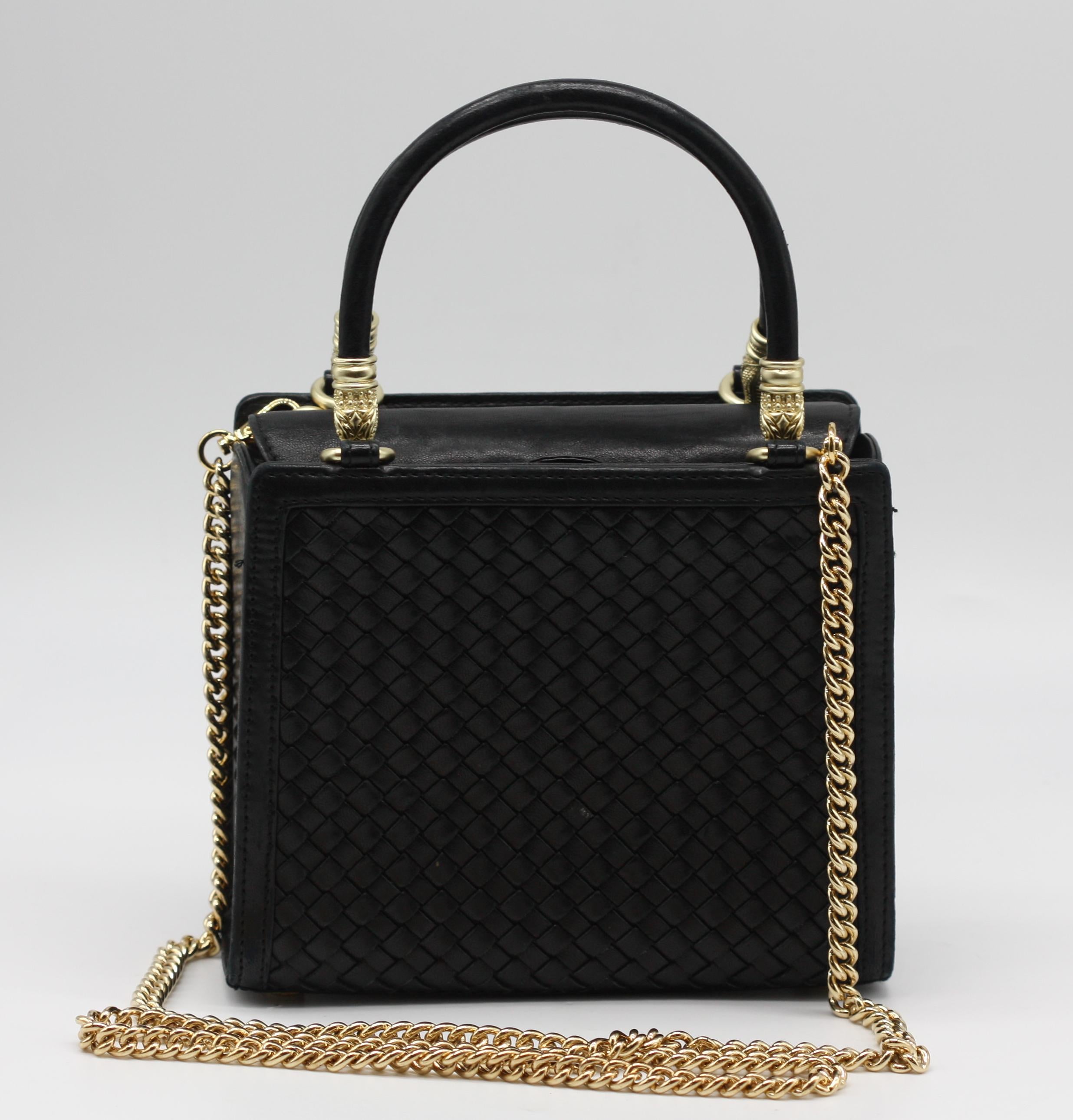Barry Kieselstein-Cord Woven Black Leather Handbag

An elegant rectangular handbag by Barry Kieselstein-Cord, finely woven in black leather and distinguished by double rolled handles. The matte gold-toned hardware, cast with crocodile heads,