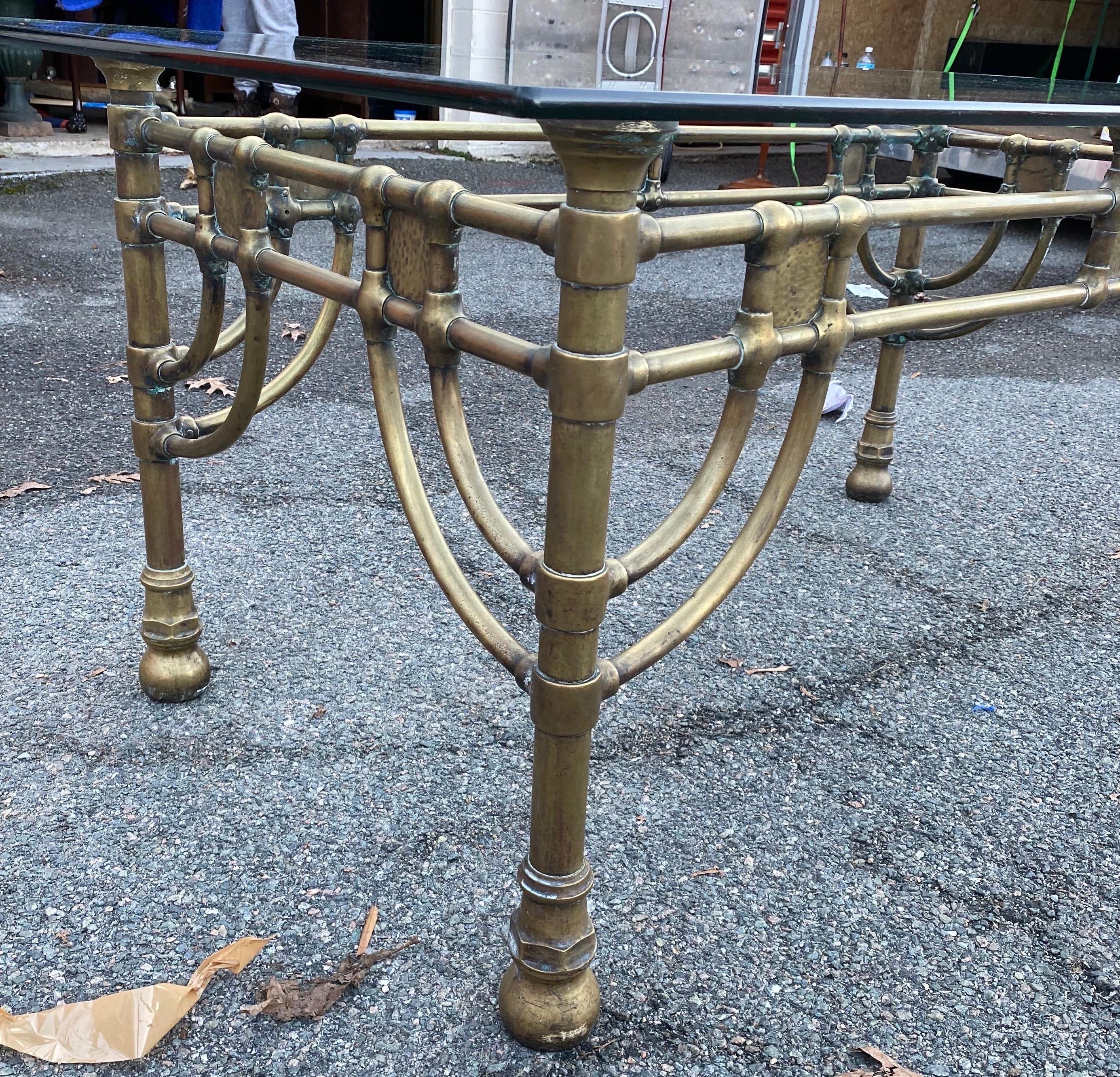 Very good quality midcentury brass and glass table. Measures: 27