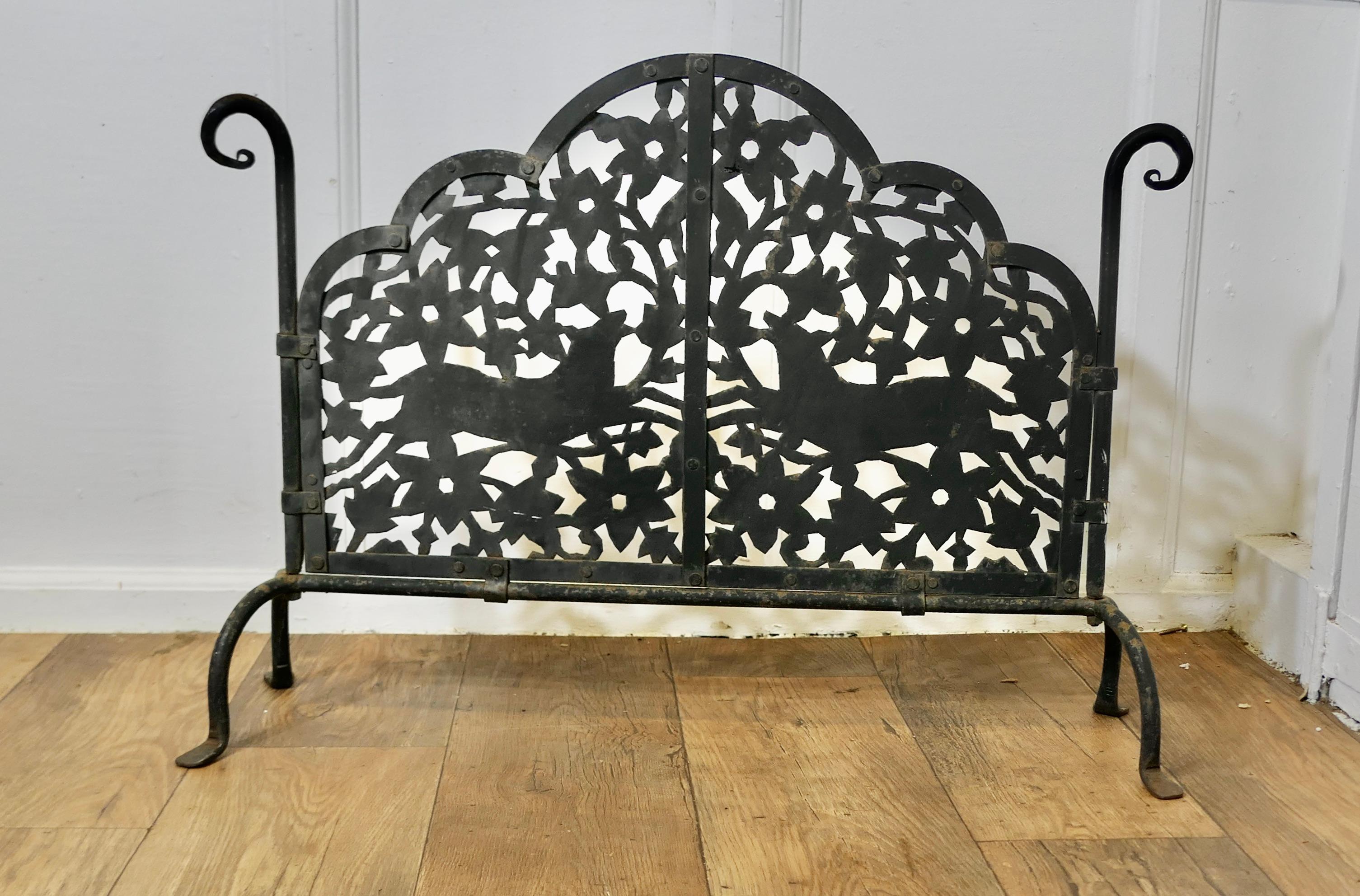 Very Heavy Old Gothic Pierced Wrought Iron Fire Screen

This is a very attractive piece, the wrought iron work is superbly executed forming a heavy weight stand it has pierced iron infill showing 2 hunting dogs and leaves
In good sound condition and