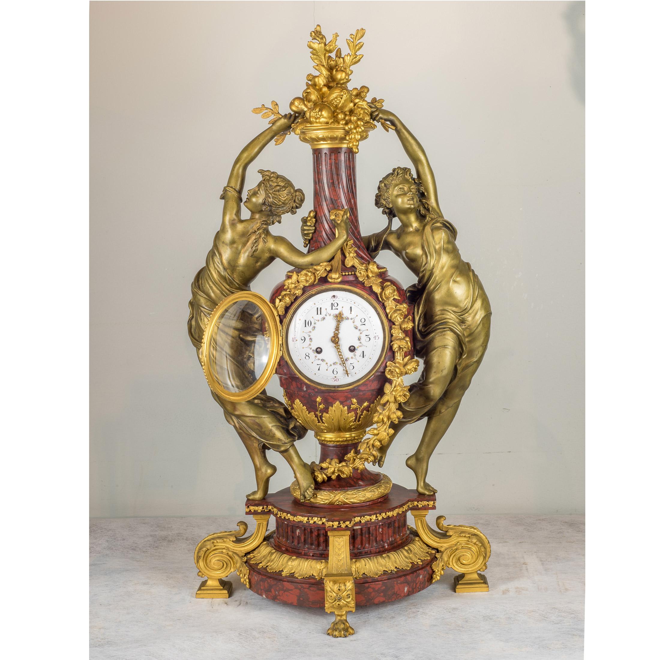 A very important French gilt bronze and Rouge marble figural mantel clock by Japy Frères

Movement: Japy Frères (1806-1930)
Origin: French
Date: 19th century
Dimension: 30 3/4 in. x 16 1/2 in.