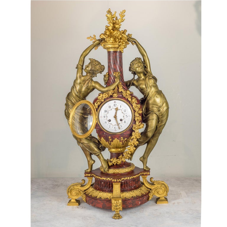 A very important French gilt bronze and Rouge marble figural mantel clock by Japy Frères

Movement: Japy Frères (1806-1930)
Origin: French
Date: 19th century
Dimension: 30 3/4 in. x 16 1/2 in.
