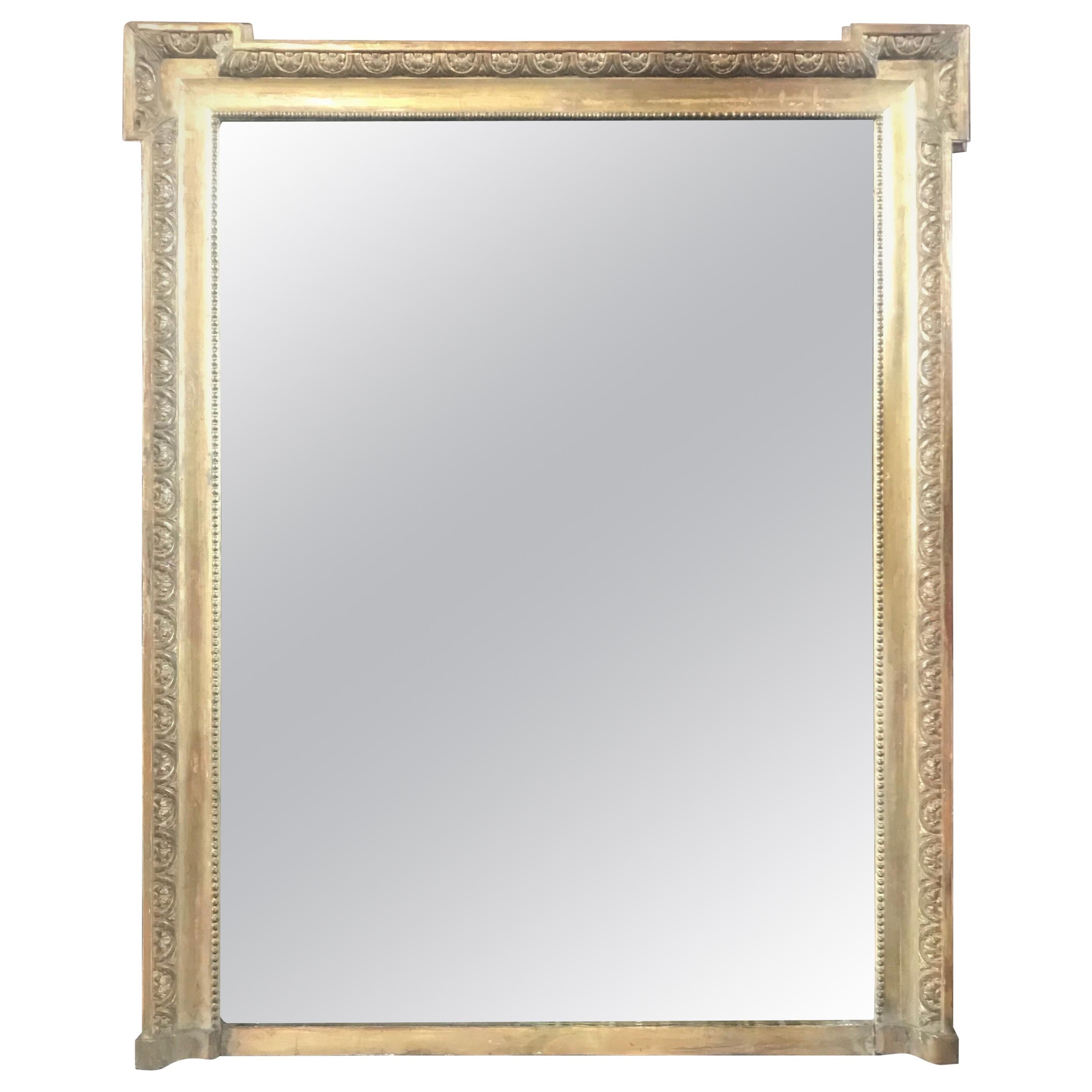 Very impressive French antique Louis XIV giltwood carved mirror. Can serve beautifully as a floor, wall or mantel mirror.

#3517.