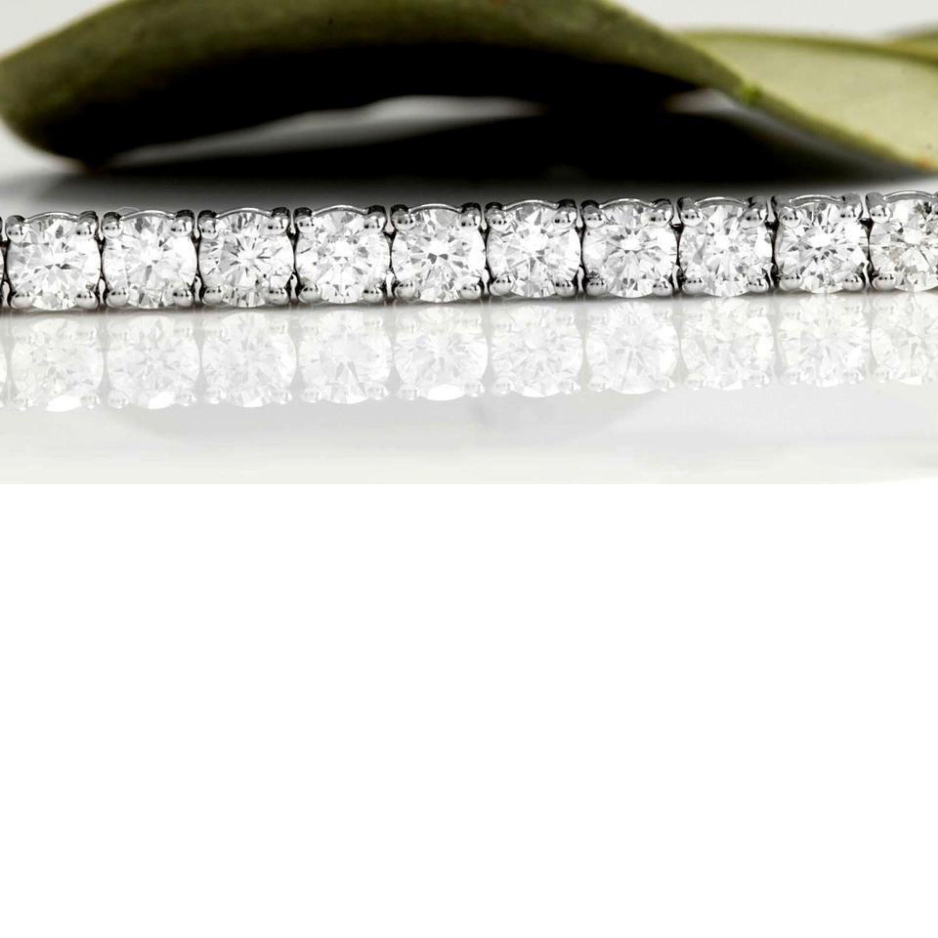 Very Impressive 3.35 Carats Natural Diamond 14K Solid White Gold Bracelet

STAMPED: 14K

Total Natural Round Diamonds Weight: Approx. 3.35 Carats (color G-H / Clarity SI1-SI2)

Bracelet Length is: 7 inches

Width: 2.45mm

Bracelet total weight: