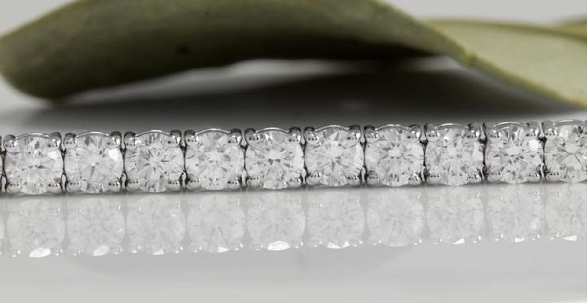 Very Impressive 4.15 Carats Natural VS Diamond 14K Solid White Gold Bracelet

STAMPED: 14K

Total Natural Round Diamonds Weight: 4.15 Carats (color F-G / Clarity VS2-SI1)

Bracelet Length is: 7 inches

Width: 3.28mm

Bracelet total weight: