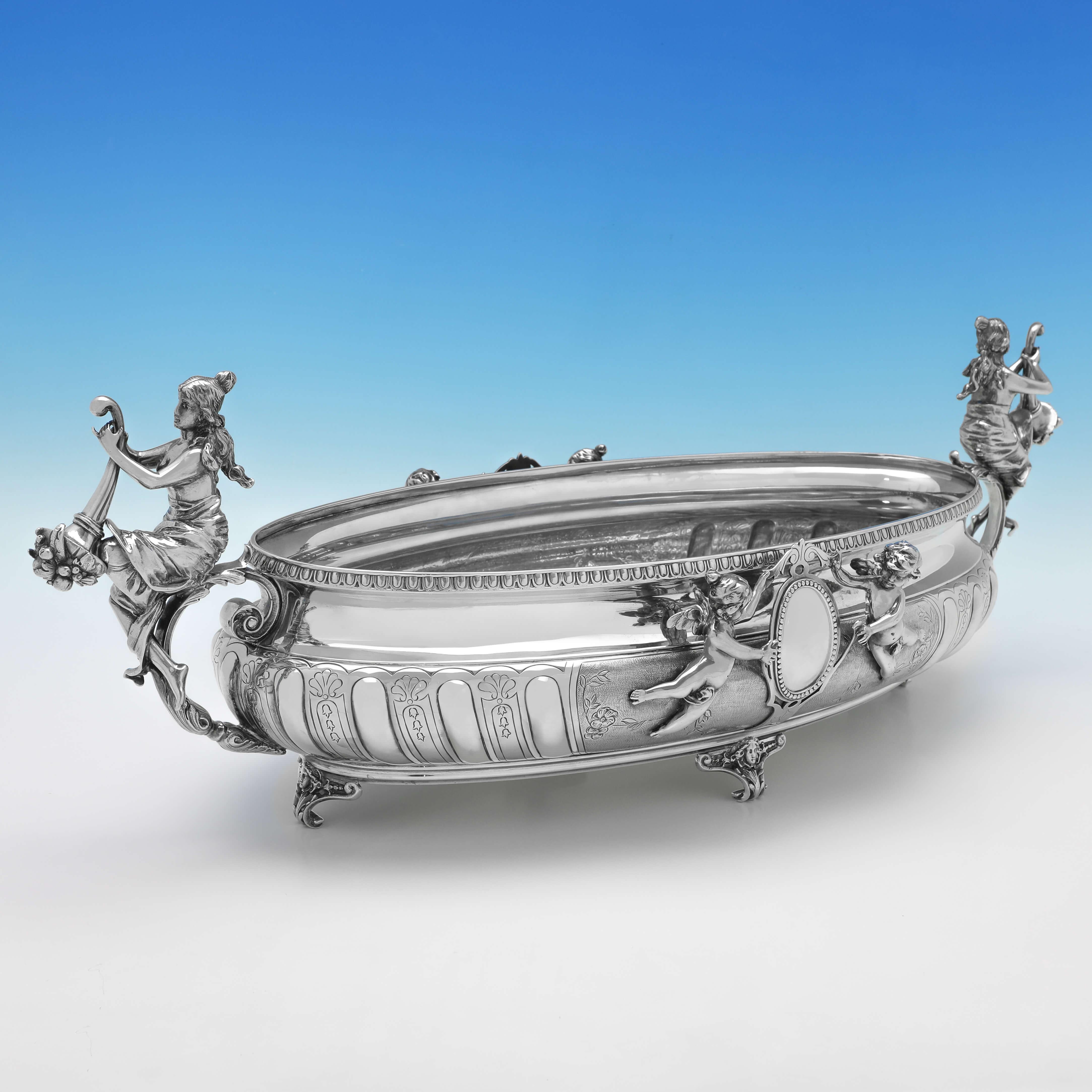 Carrying German silver marks used by Koch & Bergfeld from c.1870-1885 in Bremen, this impressive, Antique Sterling Silver Jardiniere, is oval in shape, and ornate in design, with wonderful chased and engraved decoration to the body, winged cherub