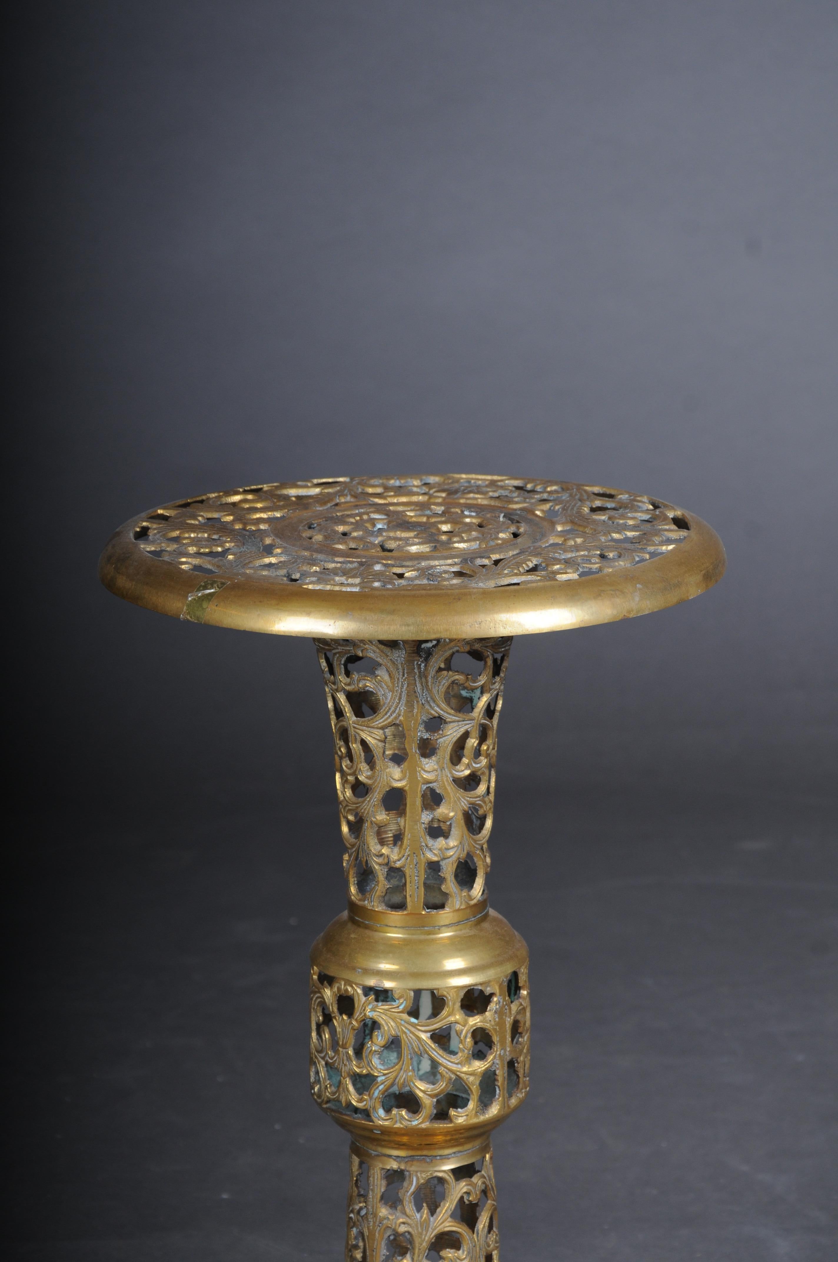 Very interesting ornate Moorish brass side table.

Solid brass body. Full Body Embellished. Wide top plate and base, also decorated. Highly decorated conical body.

 Very unusual and rare. Moorish style.