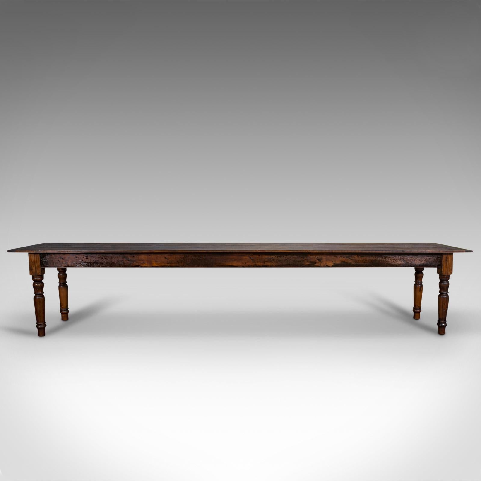 This is a very large antique dining table. An English, pine country house table for 12-16 people, dating to the Victorian period and later, circa 1900.

Captivating proportion at 4 metres (13.13') long
Displays a desirable aged patina and
