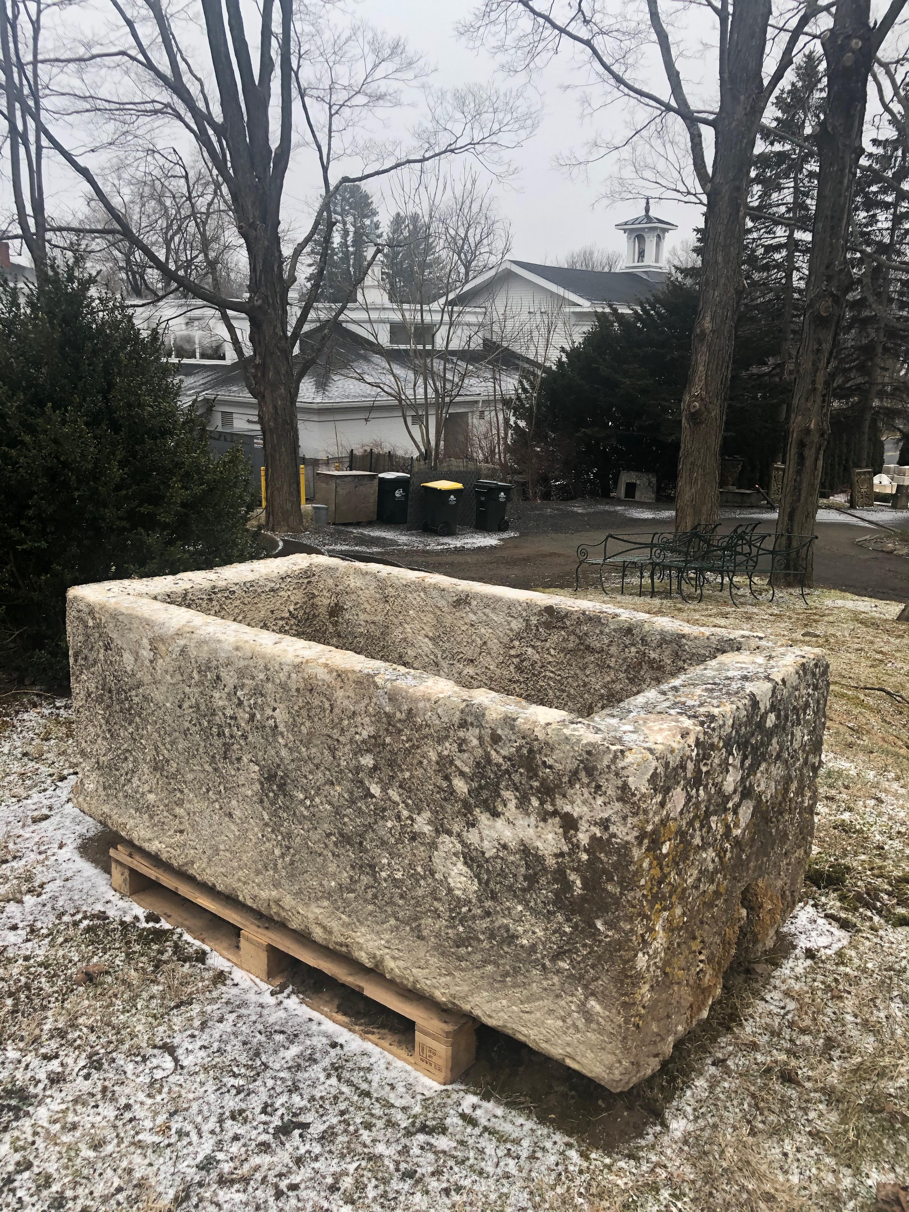 This hand-carved limestone trough is exceptional in all respects. It has a stunning patina that reads pale-medium grey, an original grain hole, and is evenly-carved all the way around. We have tested it for water-tightness and there are no leaks,