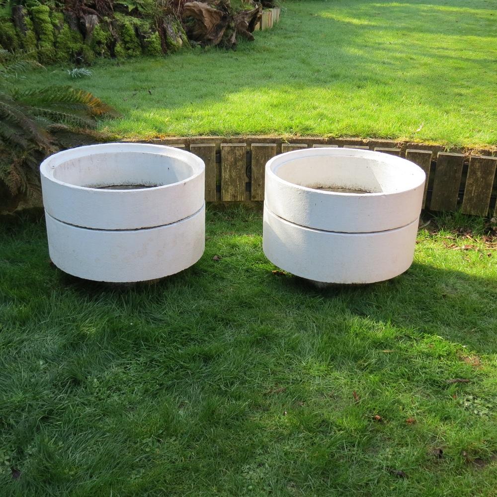 Pair of very large municipal circular concrete garden planters.  Very good sized planters that date from the 1970s and were originally used in town and shopping centres.  Made from reinforced concrete, they each come in three sections, a base and