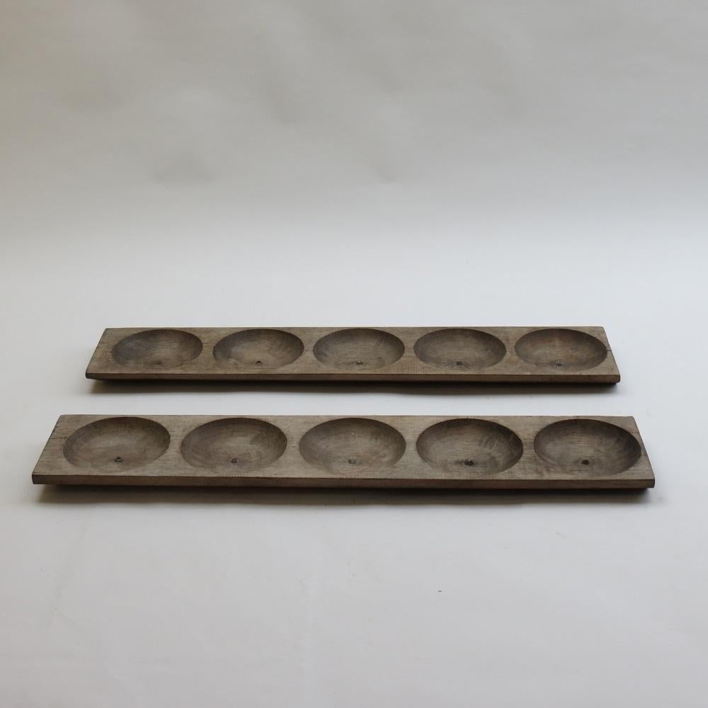 Wonderful dough troughs from Cyprus. They date from the 1970s, originally used for dough.

Made from solid pine, very nicely patinated.

Can be used as table decor or can be hung as a wall sculpture.

2 available, priced individually.
Please email