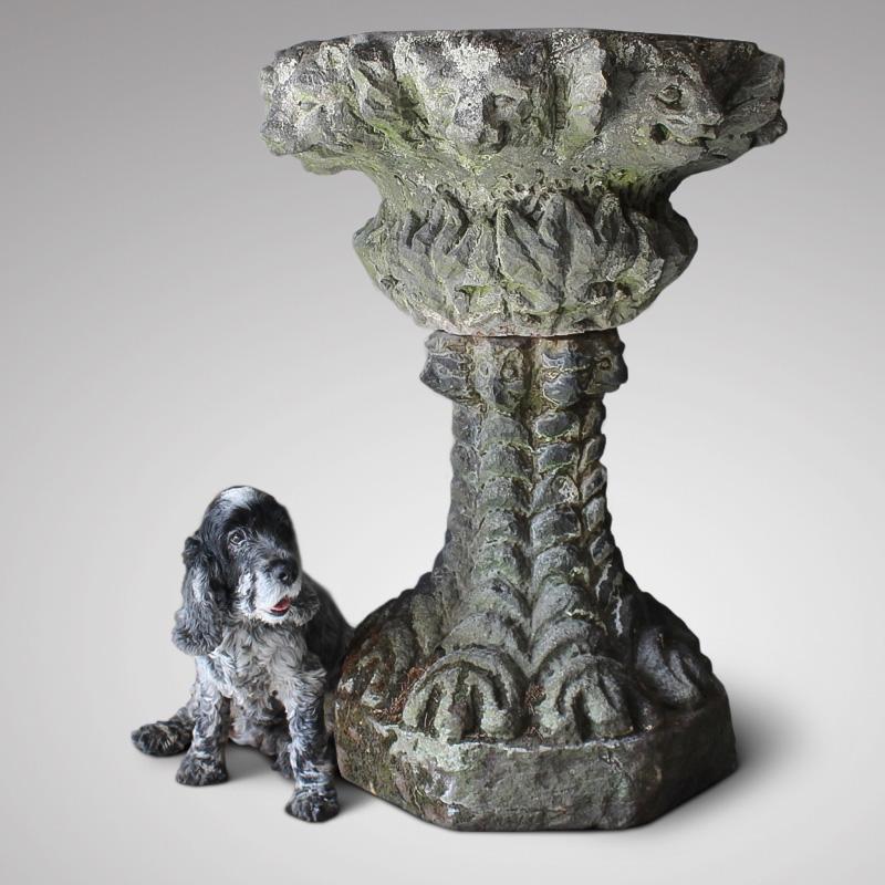 A rare and large, 19th century, carved sandstone gothic grotto urn, beautifully weathered and lichen encrusted, with a border of grotesque animal faces around the top of the bowl and base.

English, circa 1850, Staffordshire

Grotto; a small