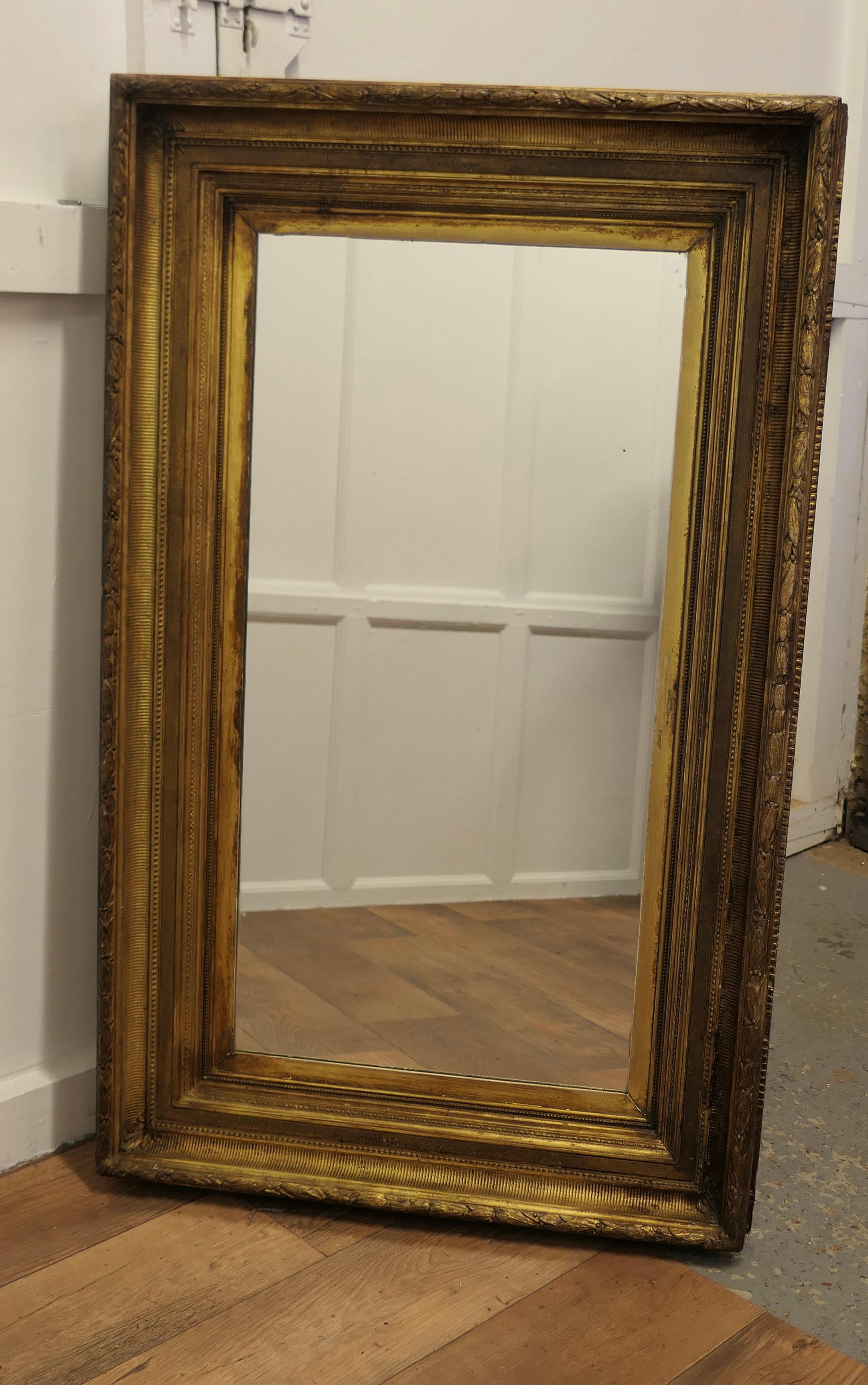 Very Large 19th Century Gilt Wall Mirror

This Superb Very Large deeply moulded Gilt 7” Frame encloses this mirror, the frame has an inward downslope with moulded decoration 

The frame dates from the mid 19th Century and it can be hung either