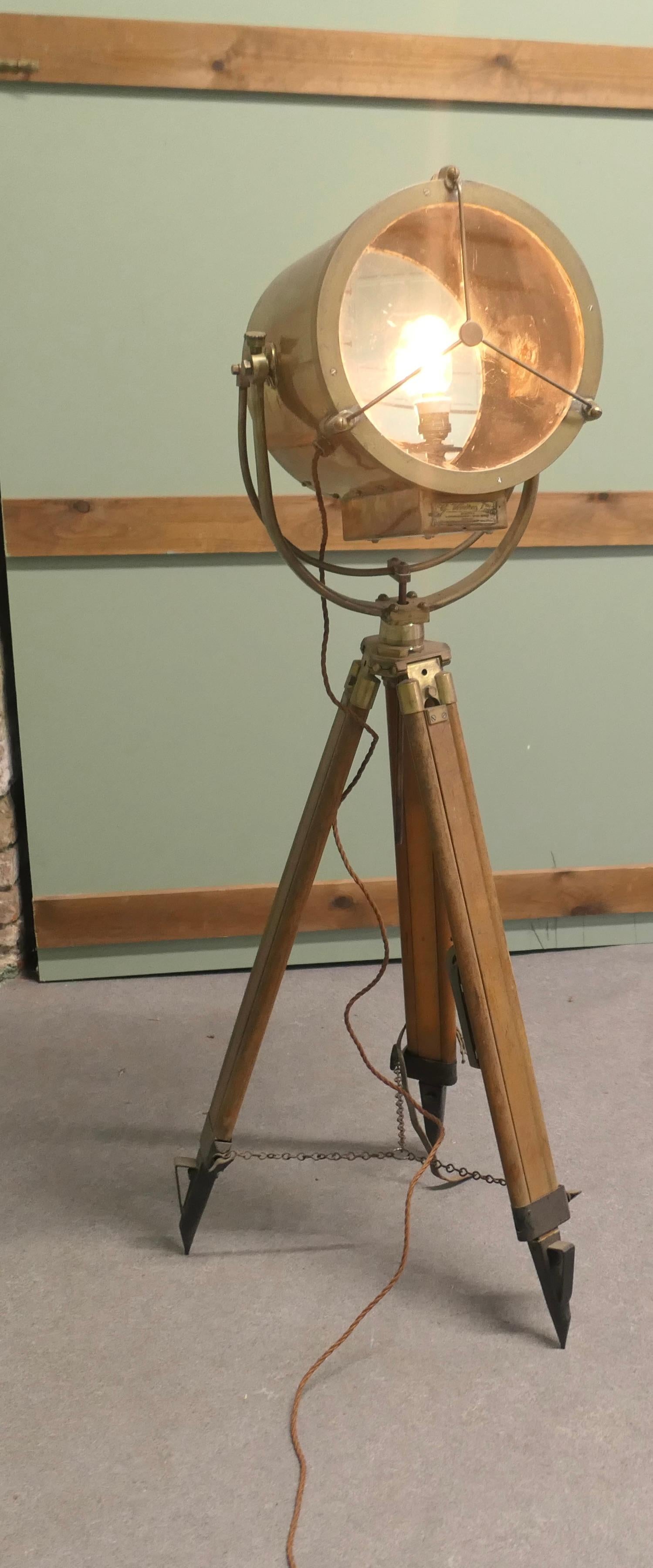 Very Large 19th Century Vintage Nautical Search Light or Spot Light by G Vieira

The Lamp is in brass it is very large and set on a wood and brass tripod, it is fully tilting and swivelling, it has makers plaque reading G Vieira Portugal 
The