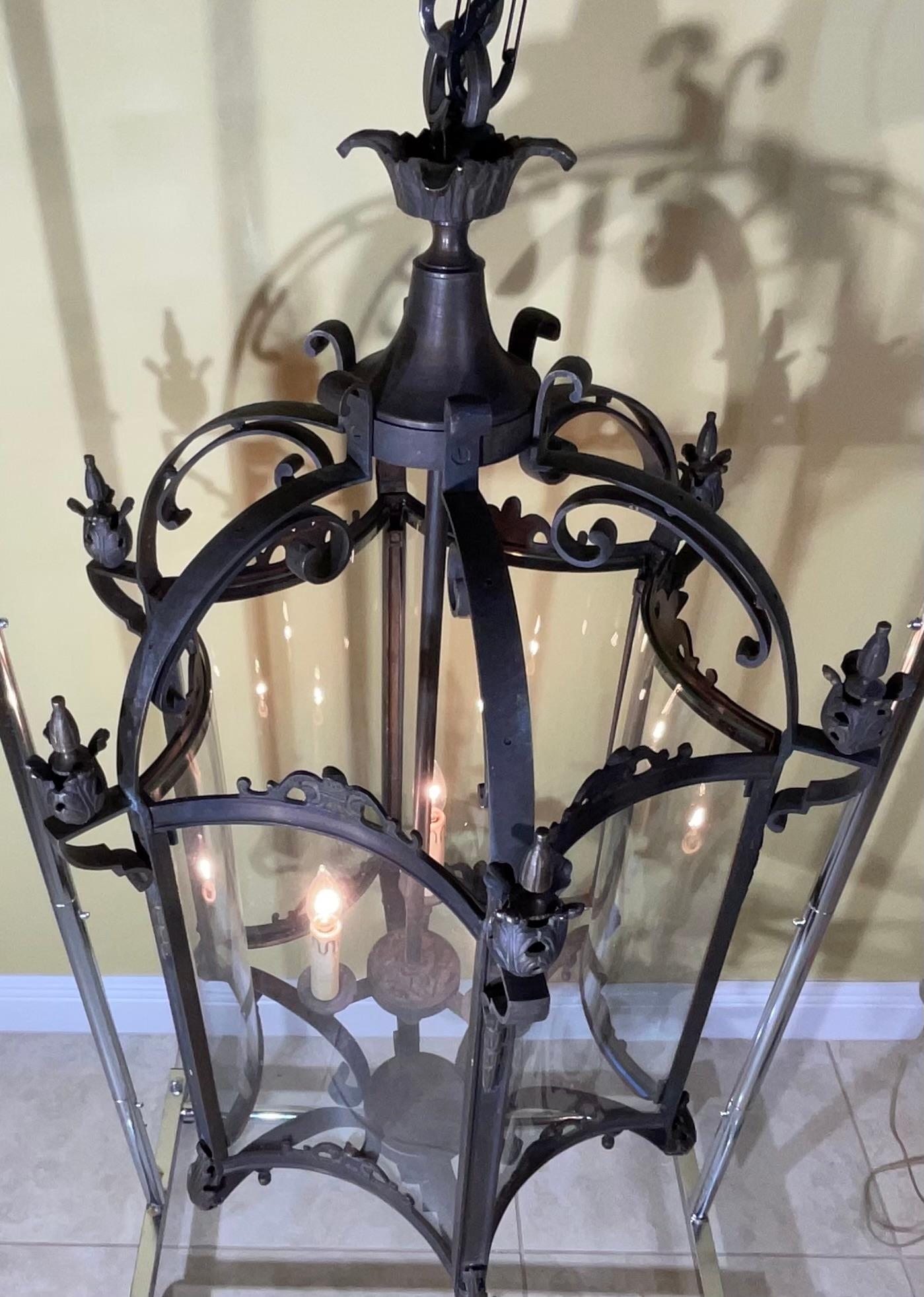 Elegant, large chandelier/ lantern made of solid bronze, six sides  with thick curved glass , three 60/watt lights , original canopy and five foot chain included.
Beautiful object of art for wall hanging .
