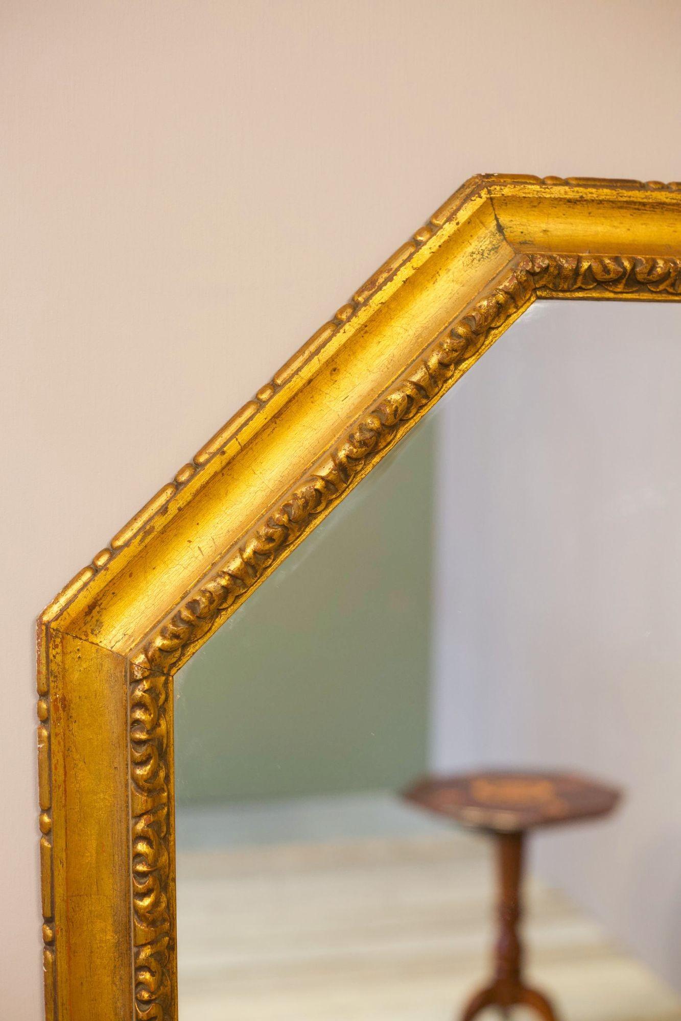 This is a very large 20th century gilt mirror. Nice aged patina to the frame and large clear mirror plate. The overall quality is very good with no major faults. It can be hung either portrait or landscape. The frame has very attractive moulded