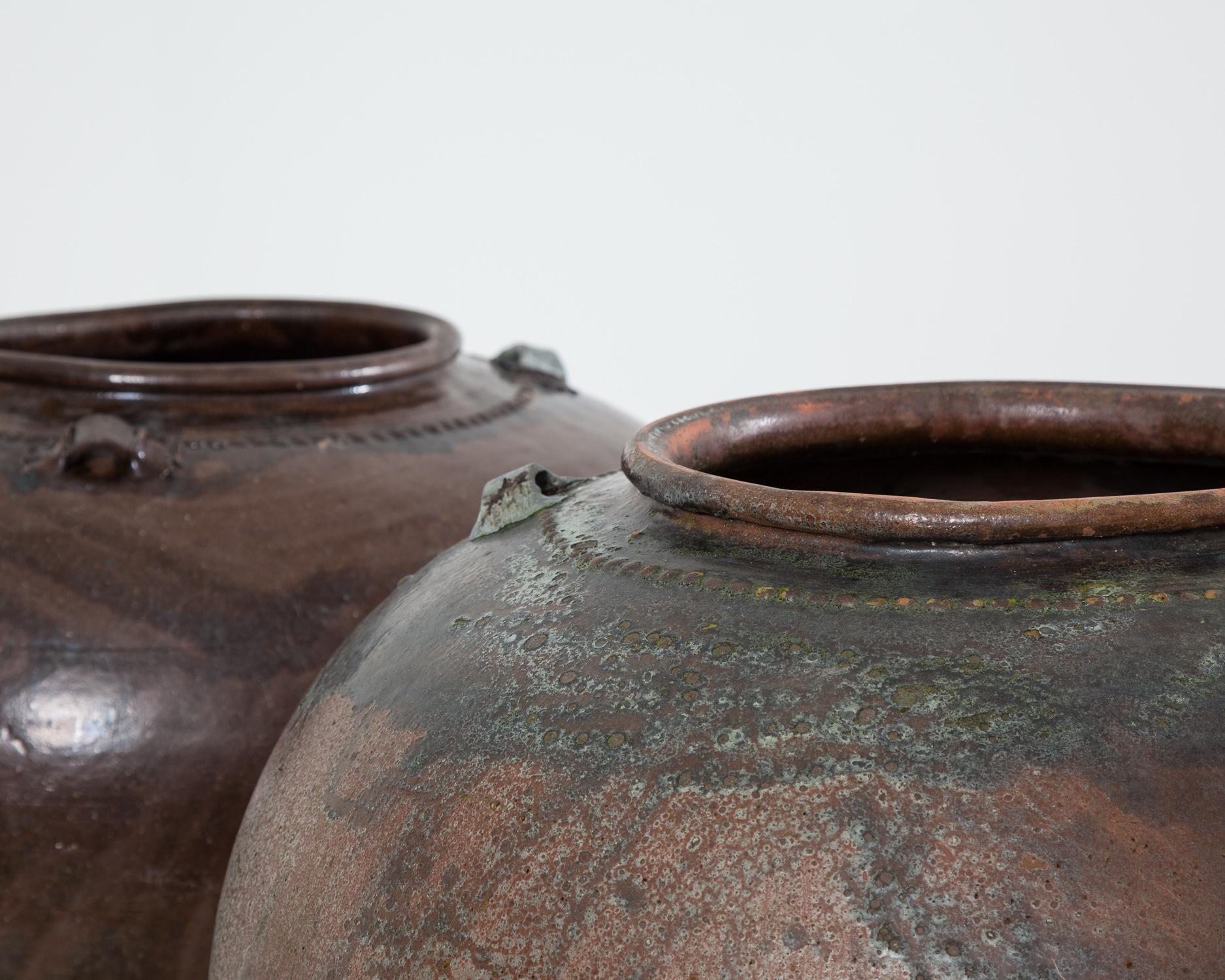 Very large, spectacular looking 20th century Spanish pots.

Both pots are in good sound condition, the smaller pot has a stabile crack which likely happened during the firing process.

The pots are available to purchase individually or as a