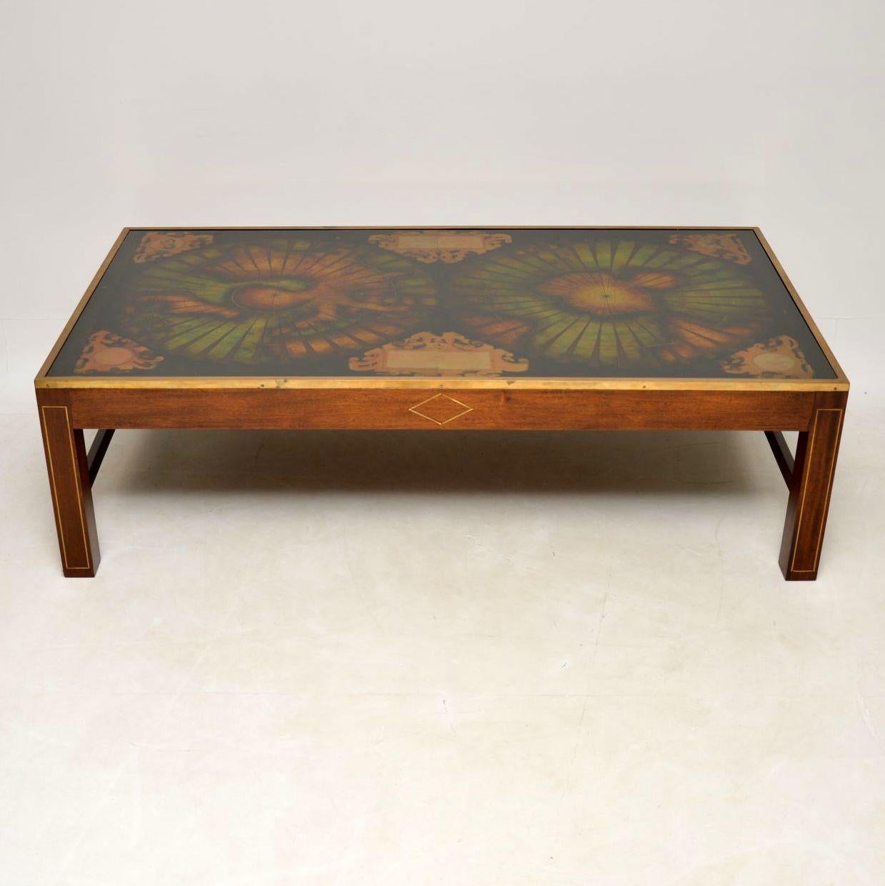 This antique atlas coffee table is extremely large and it's very hard to get the right perspective of the real size in the images, so please double check the measurements. As we all know, large antique coffee tables are very hard to find. I think