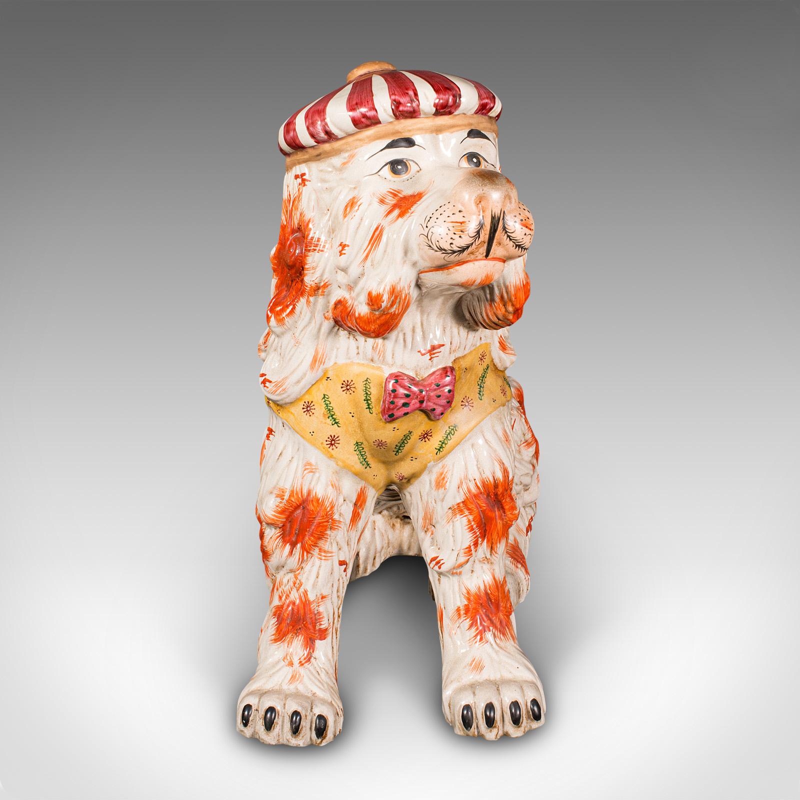 This is a very large antique decorative dog. An English, ceramic figure in life-size proportion, dating to the late Victorian period, circa 1900.

Of extraordinary scale and a wonderfully unusual example of the traditional Staffordshire