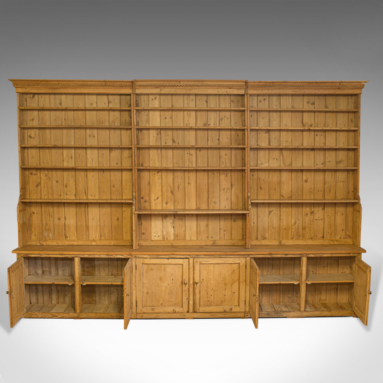 This is a very large, antique dresser at over 13 feet wide and 9 feet tall. A handmade, Victorian, pine, kitchen cabinet or bookcase of country house proportions dating to the mid-19th century, circa 1850.

Substantial cabinet of country house