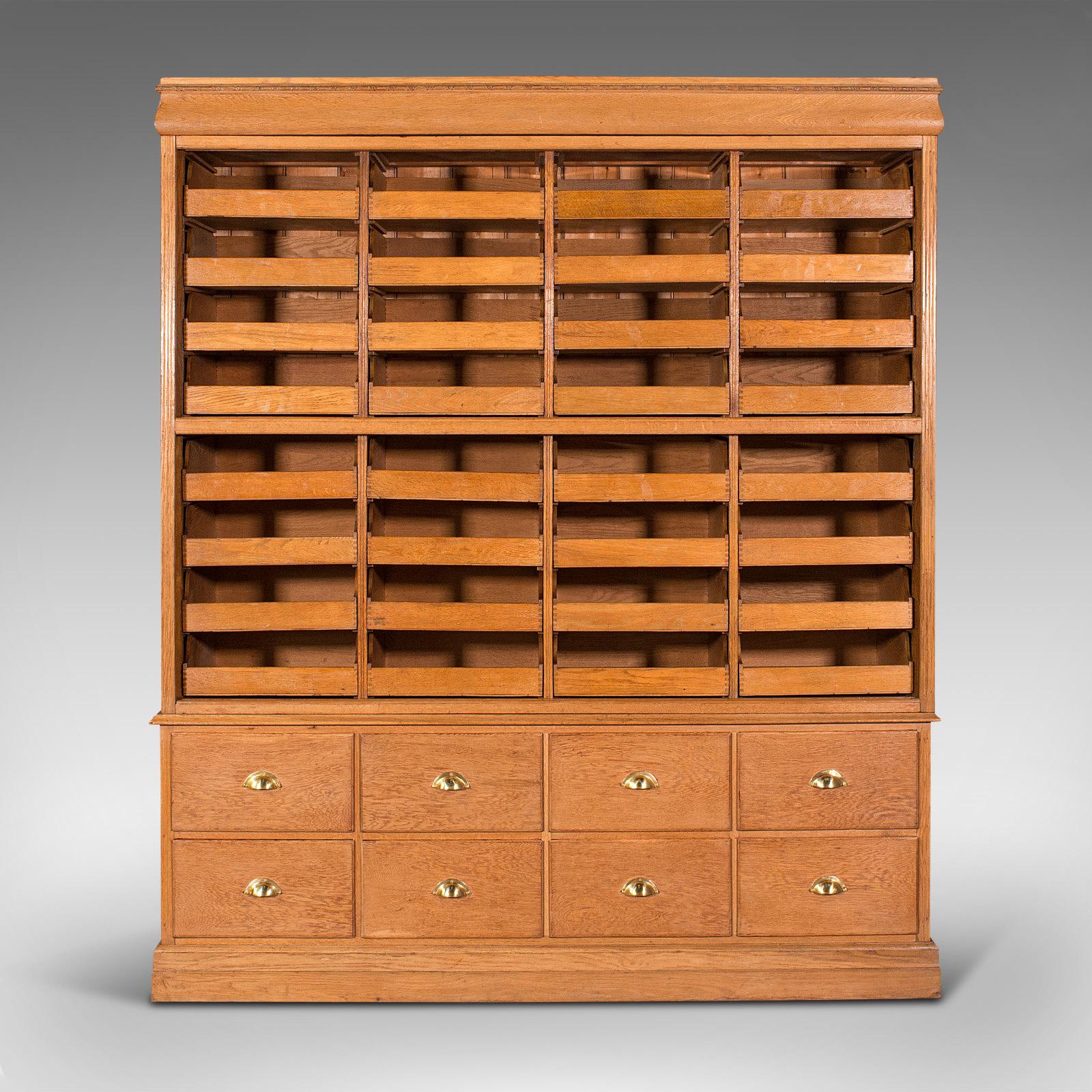 This is a very large antique haberdashery cabinet. An English, oak collector's, shop retail or specimen rack, dating to the Edwardian period, circa 1910.

Superb proportion with generous suite of storage trays
Displays a desirable aged patina
