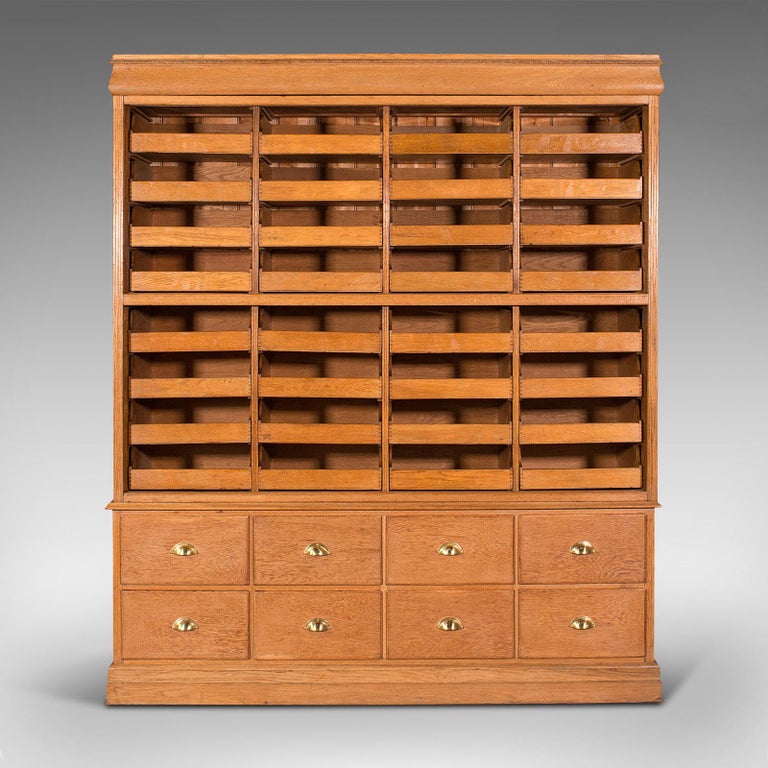 This is a very large antique haberdashery cabinet. An English, oak collector's, shop retail or specimen rack, dating to the Edwardian period, circa 1910.

Superb proportion with generous suite of storage trays
Displays a desirable aged patina