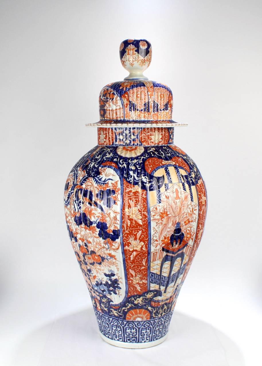 An extraordinarily large, antique Japanese Imari covered urn or floor vase.

With strong cobalt blue and red decoration, some traces of the original gilding, ribbed sides, and its original cover.

Simply an impressive size and very good