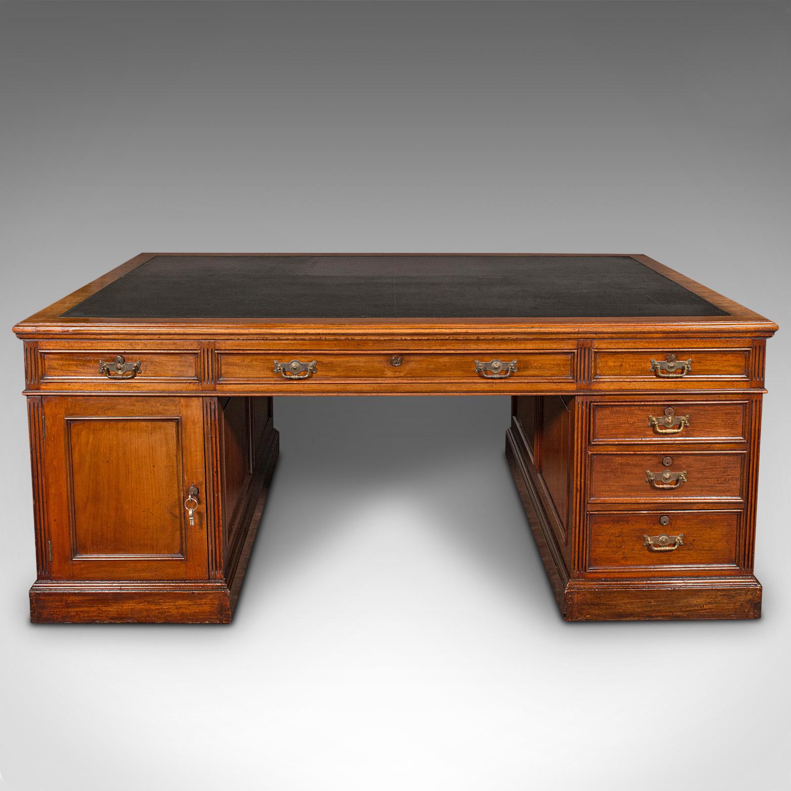 This is a very large antique partner's desk. An English, mahogany and leather twin pedestal desk by Maple & Co, dating to the Edwardian period, circa 1910.

Exceptional proportion and arrangement to this grand desk
Displays a desirable aged patina