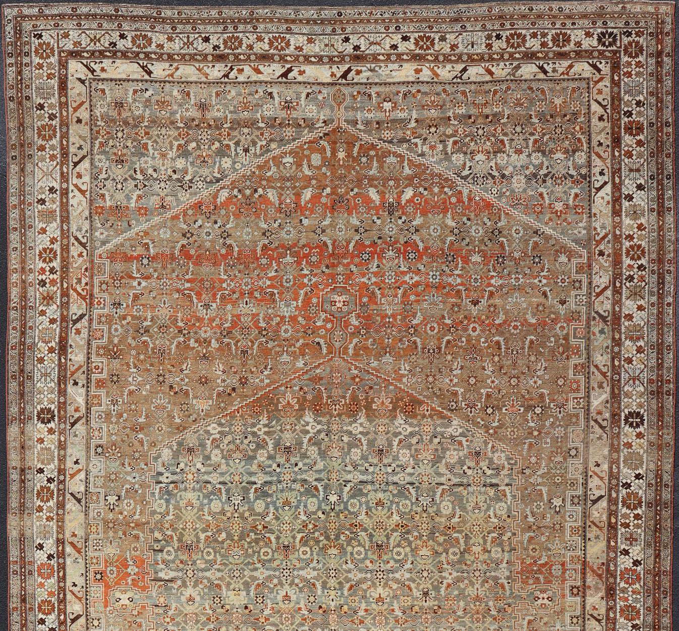 Very large and substantial Persian antique Bidjar in light orange-rust, and blue-gray, orange bronze, Taupe green.

Measures: 14'6 x 24'2

 Bidjar antique rug from Persia with ornate floral all-over design with medallion, rug SUS-2101-1065,