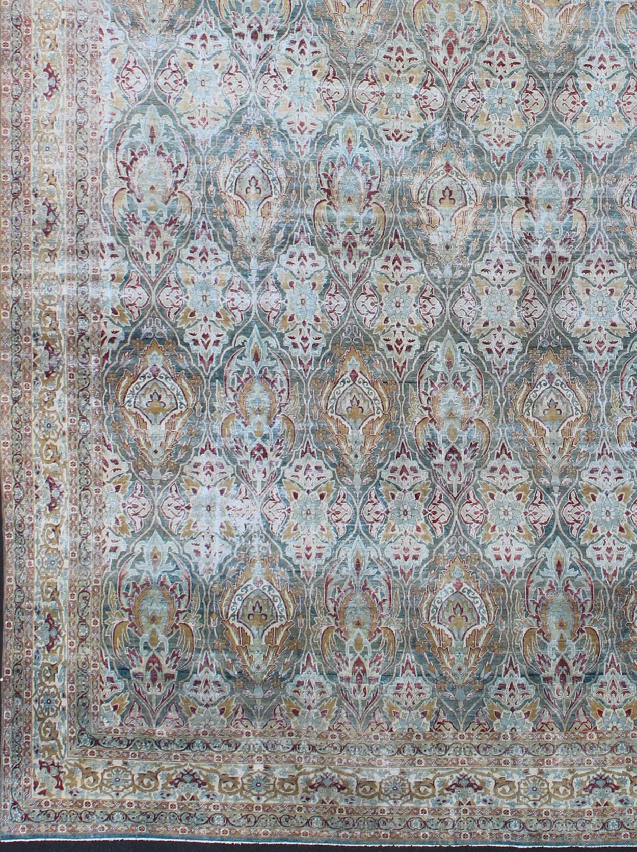 Very Large Antique finely woven Persian Lavar Kerman Rug In Large Scale Design. Large antique Persian Lavar Kerman distressed rug with large scale layered flowers in an all-over design, rug 17-1003, country of origin / type: Iran / Kerman, circa