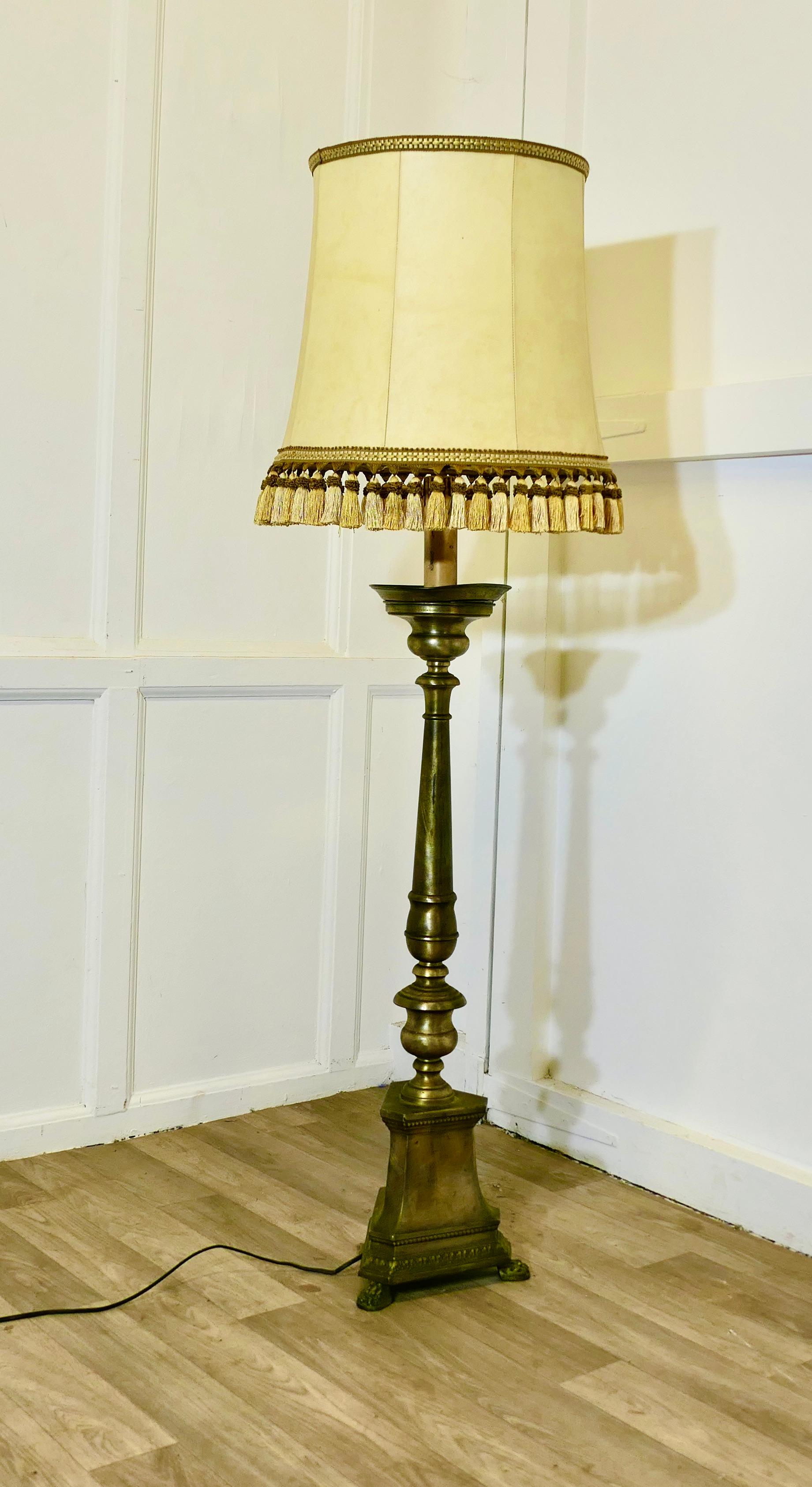 Very Large Brass Table Lamp, or a Half Height Floor Lamp

This is a very sturdy and heavy piece, the lamp has a single turned column set on a heavy triangular stepped base 
This is an attractive piece with an aged patina and comes with its original