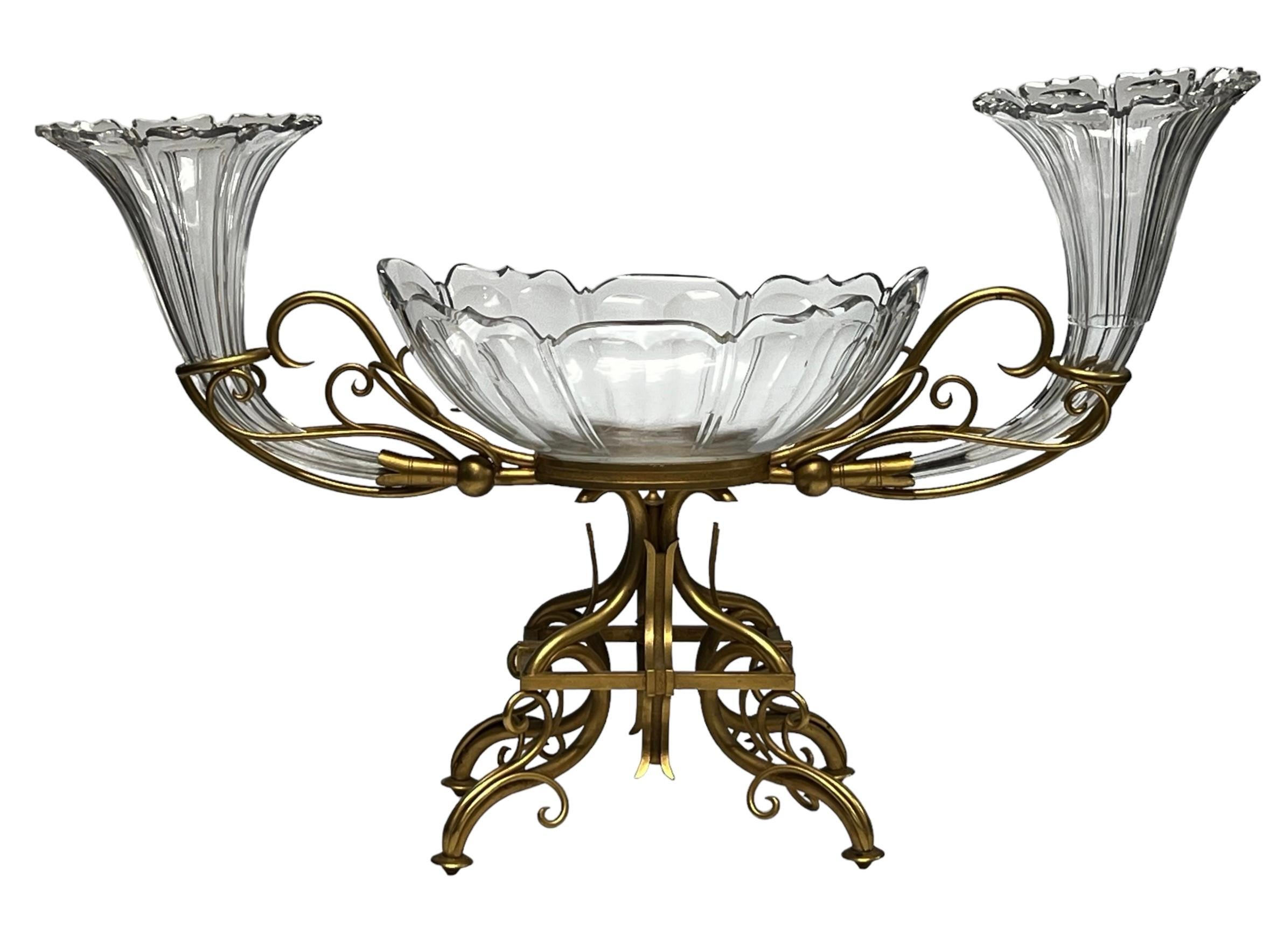 A very large and very fine quality bronze and crystal centerpiece consisting of a central bowl and a pair of vases on either sides.
Attributed to 