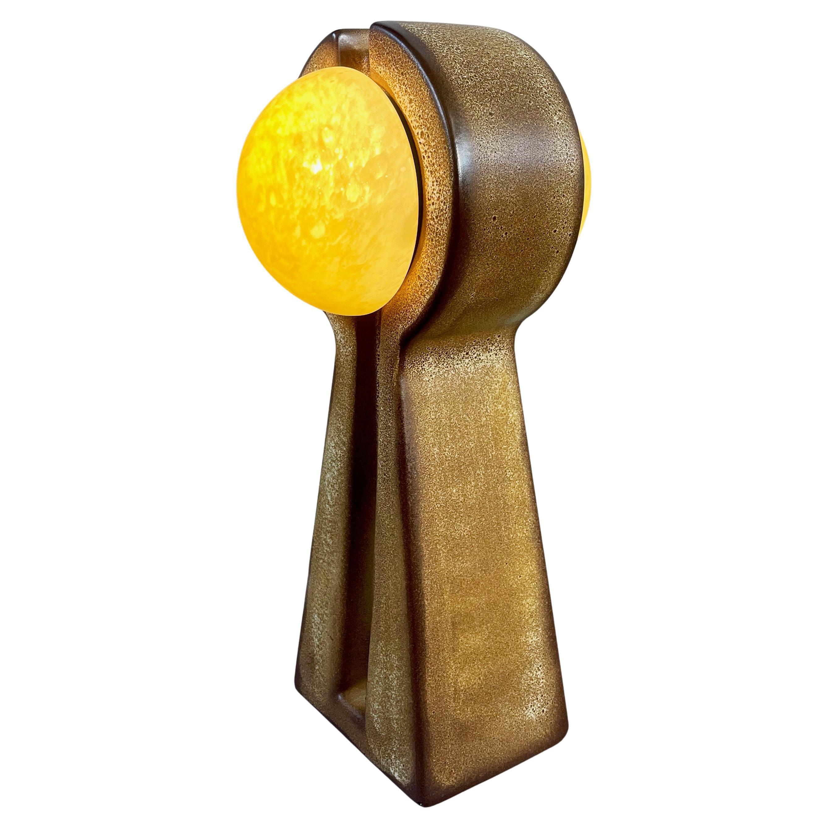 Absolutely marvellous mid-century design, one-of-a-kind very large ceramic floor lamp in an all unique Western German Fat Lava glaze.
2-sided mirroring lamp with marbled, amber coloured frosted glass (half-) spheres.
The style of this piece is a mix