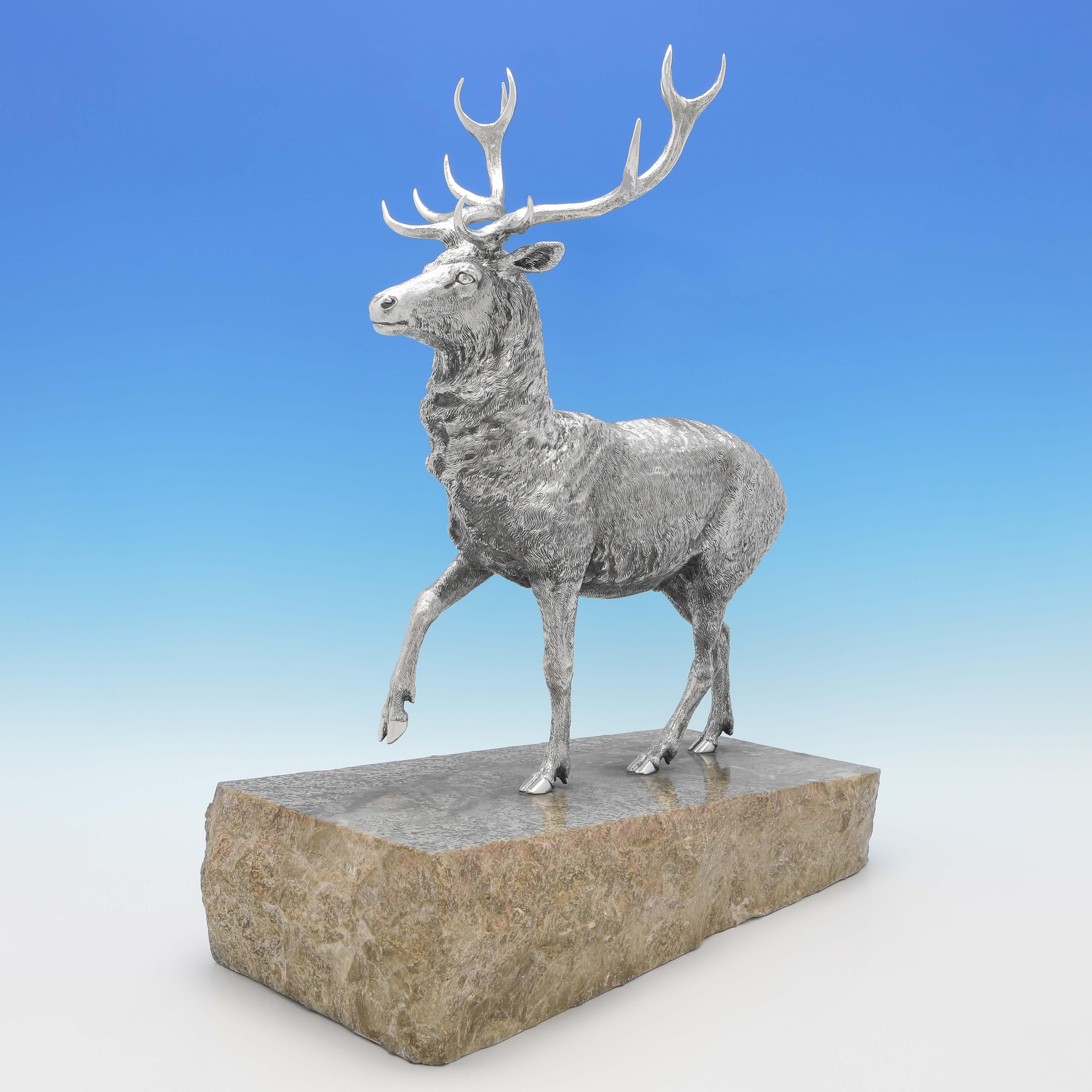 Hallmarked in London in 1976 by Garrard & Co., this stunning Elizabeth II, Sterling Silver Model of a Stag, is realistically cast and chased, and stands on a marble base. The stag model on the base measures a very impressive 21.5