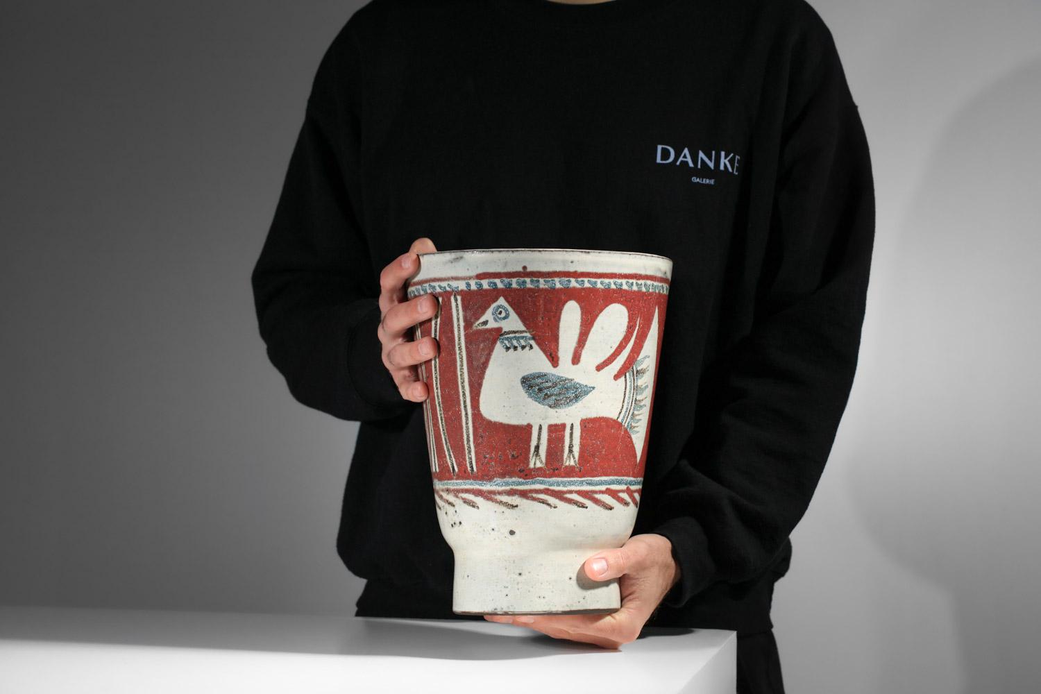 Very large ceramic vase from the 60s by ceramic artist Gustave Reynaud of Atelier le Mûrier in Vallauris. An unusual size for this large ceramic glazed in white, red and green hues and decorated with geometric designs and a bird in the artist's