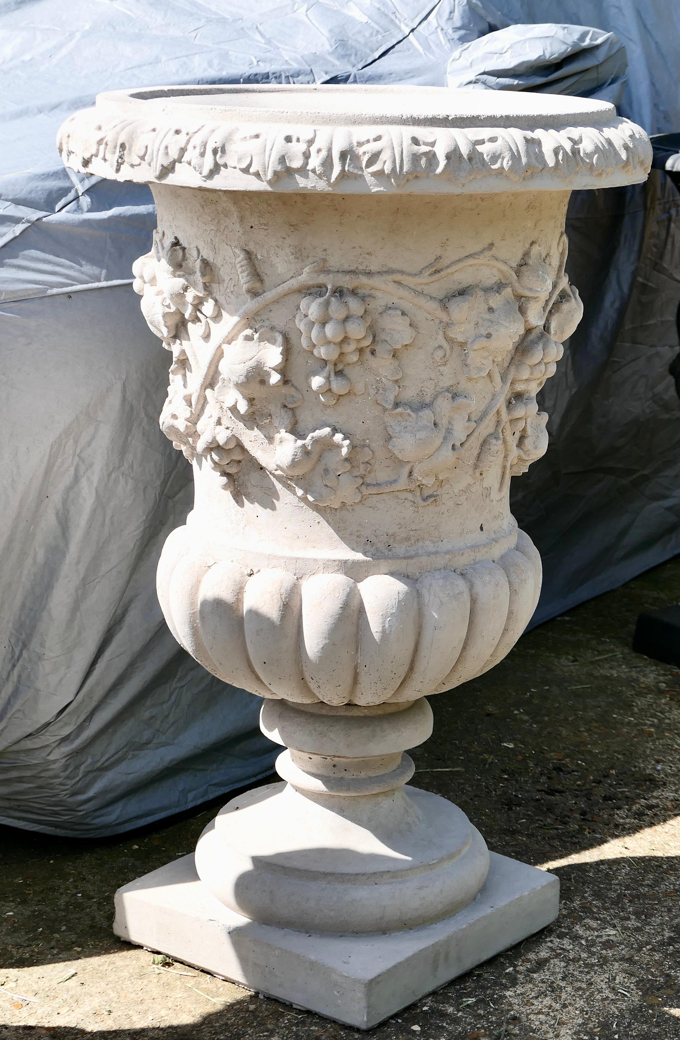 Very Large Classical Grape and Vine Garden Planter 

A  large 2 piece garden planter, decorated with entwining grape vines and bunches of grapes. 
The urn is lightly weathered and has a drainage hole in the centre
The urn is 35” tall and 25” in