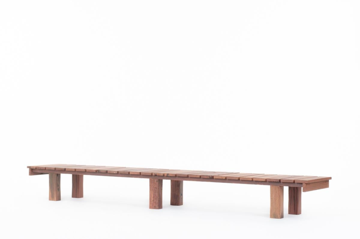 Large bench or coffee table, designed with ironwood from Indonesia. Strongly veined and naturally contrast wood with nice patina. 
This bench consists of 6 rectangular section legs with a succession of slats forming a long seat.