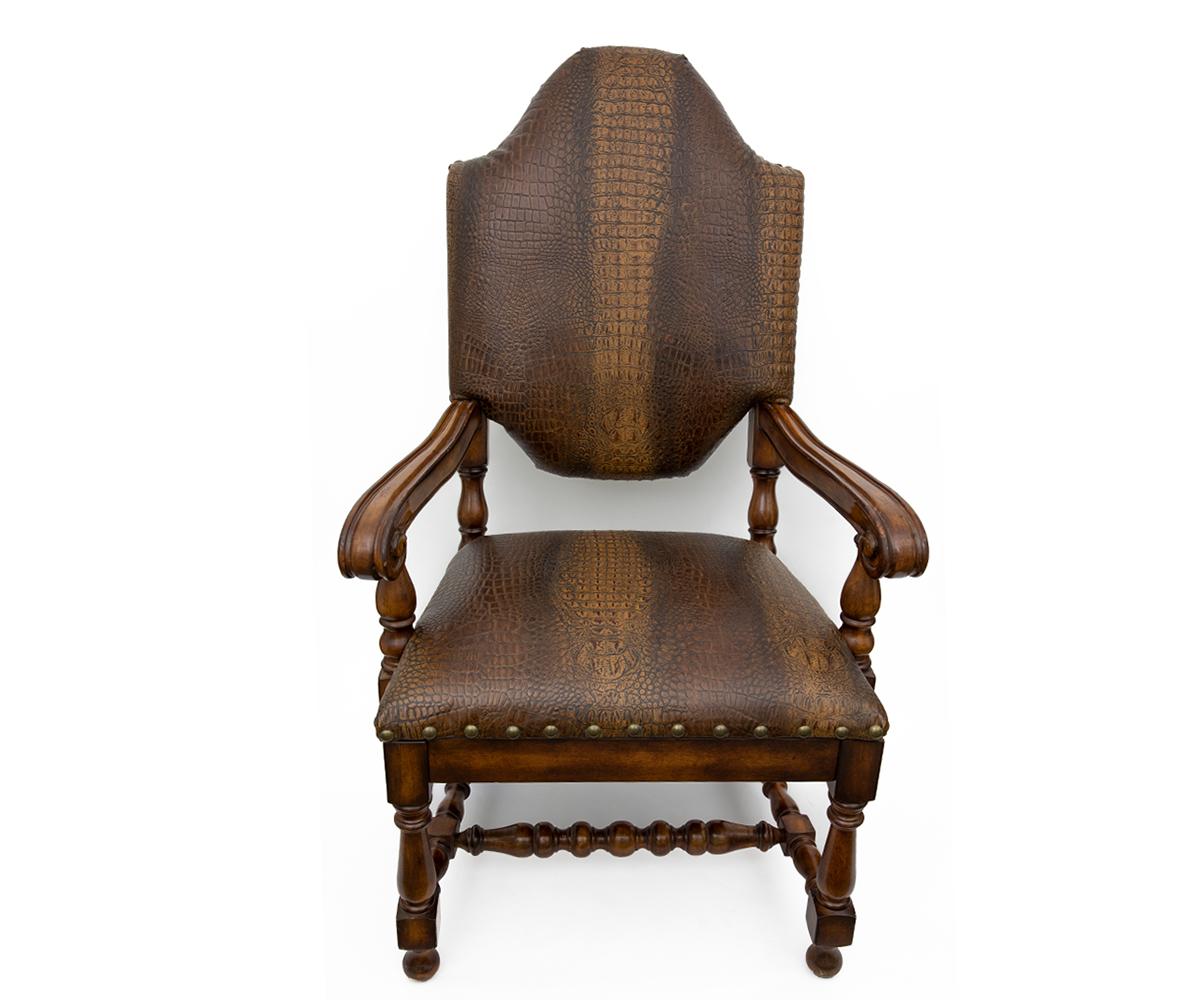 This set consists of four side chairs and two captain arm chairs. The captain chairs are newly reupholstered with leather with the two captain chairs accented with an embossed alligator leather.
Measures: Armchairs, 47