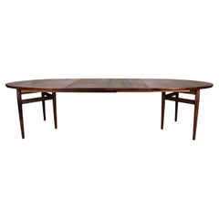 Very large Danish extendable dining table in Rosewood model 212 by Arne Vodder.