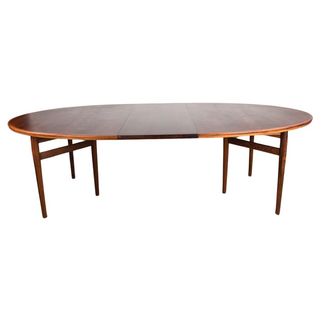 Very large Danish extendable dining table in Rosewood model 212 by Arne Vodder.