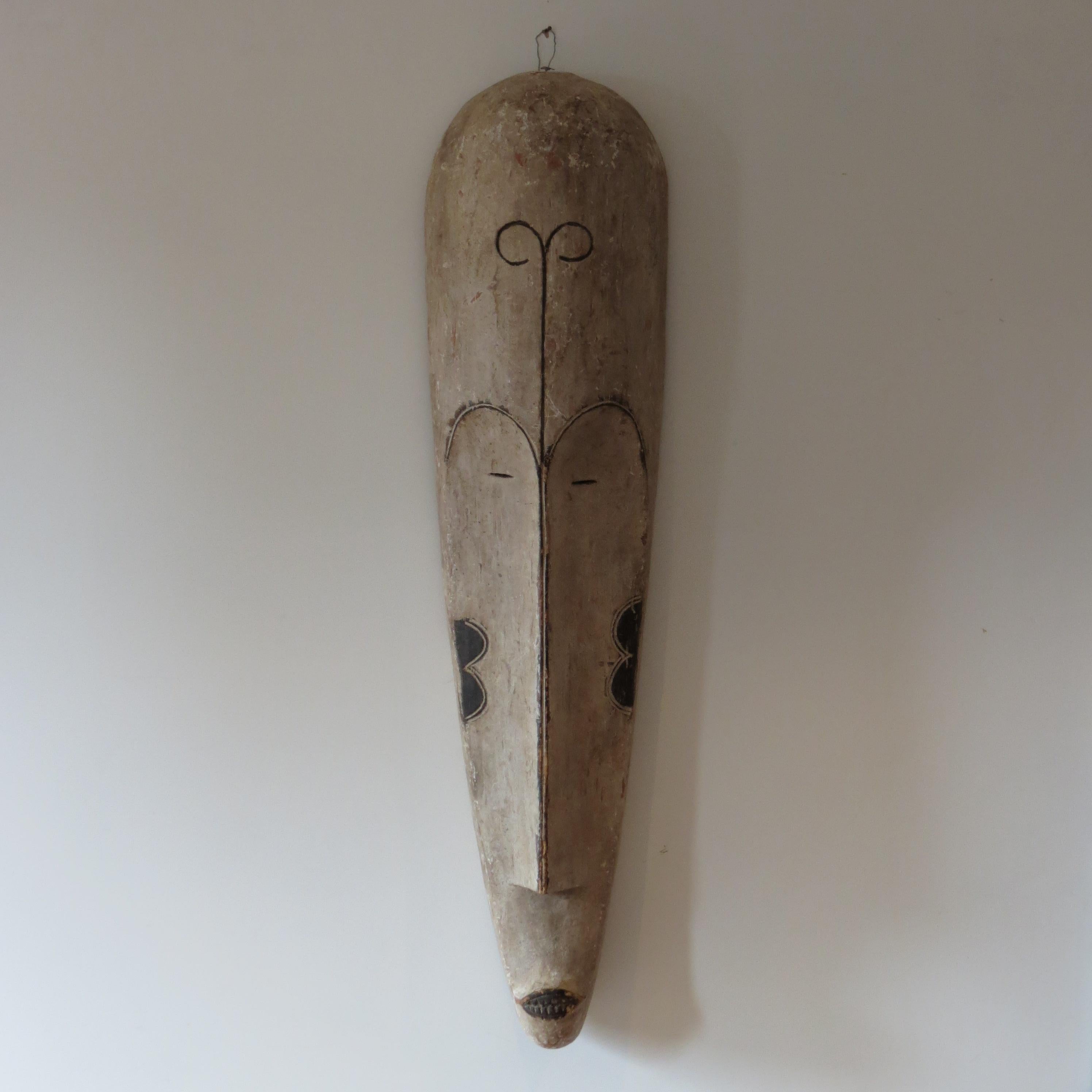 Hand-Carved Very large Elongated Tribal Fang Mask Gabon Wall Hanging Tribal Mask For Sale