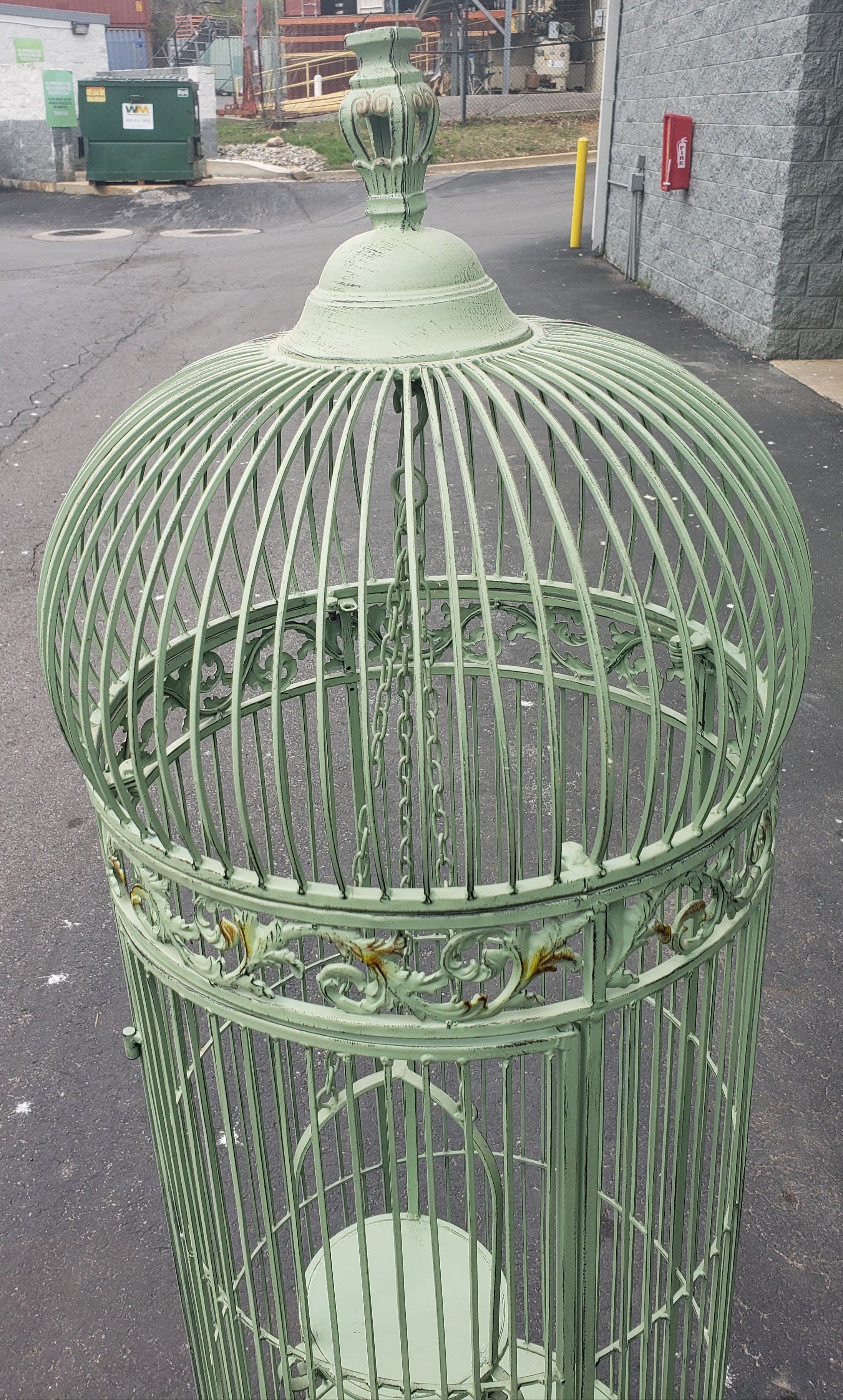 A wonderful large bird cage made of iron and wire on a scrolled footed base. Has been Painted in teal color at some point. Very good vintage condition. Video available as additional description
French early 20th century
Dimensions: 66” H x 20.5” D