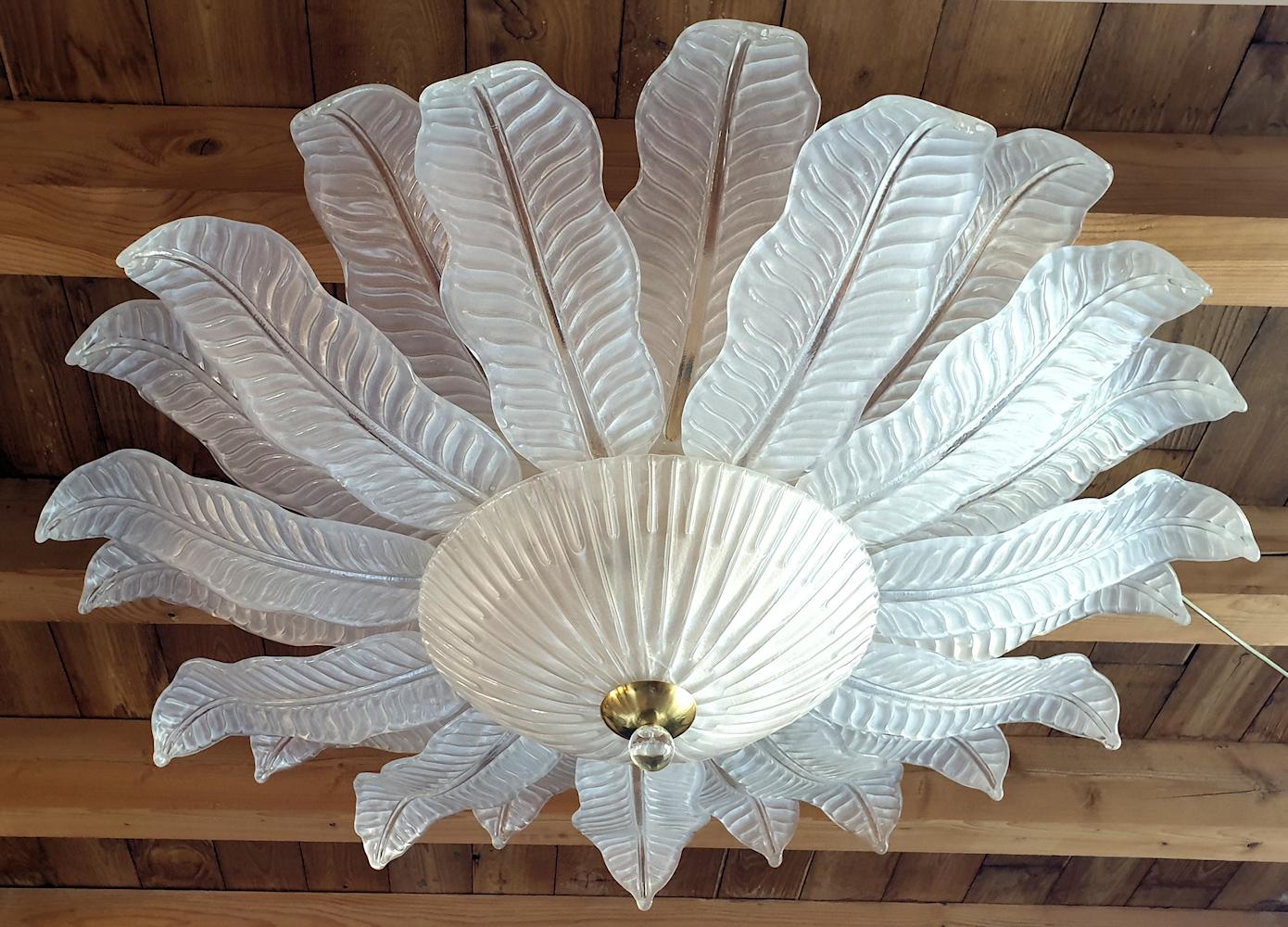 Extra large clear and frosted Murano glass leaves flushmount chandelier, by Barovier & Toso, Italy, 1970s.
The frame of the chandelier has been gold re-chromed.
Beautiful translucent warm light through the handmade Murano glass leaves.
9 lights,