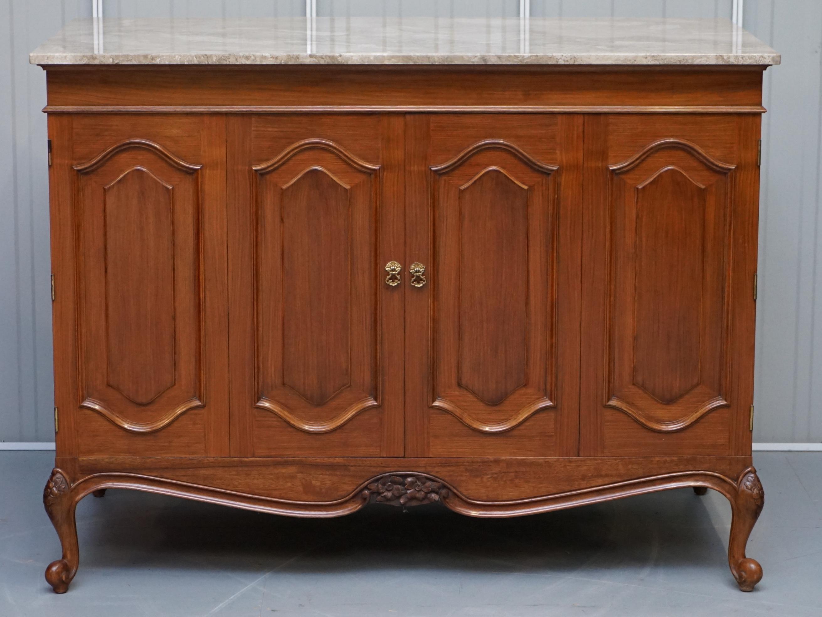 We are delighted to offer for sale this lovely French cherrywood with solid marble top and bi-folding doors media cabinet

A very well made solid piece of furniture, designed as a media cabinet for your television and or all you media boxes and
