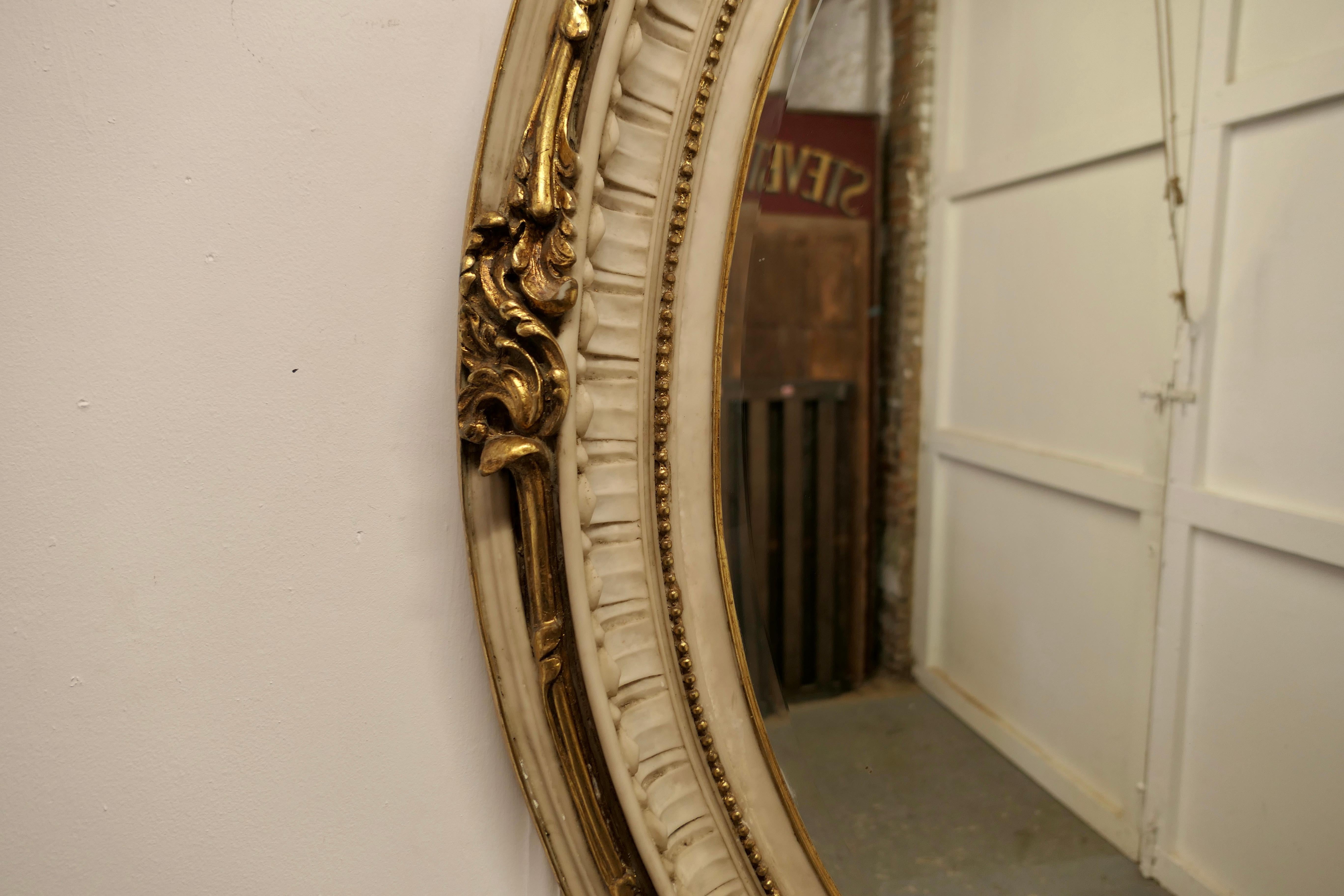 Composition Very Large French Rococo Style Oval Gilt Wall Mirror For Sale