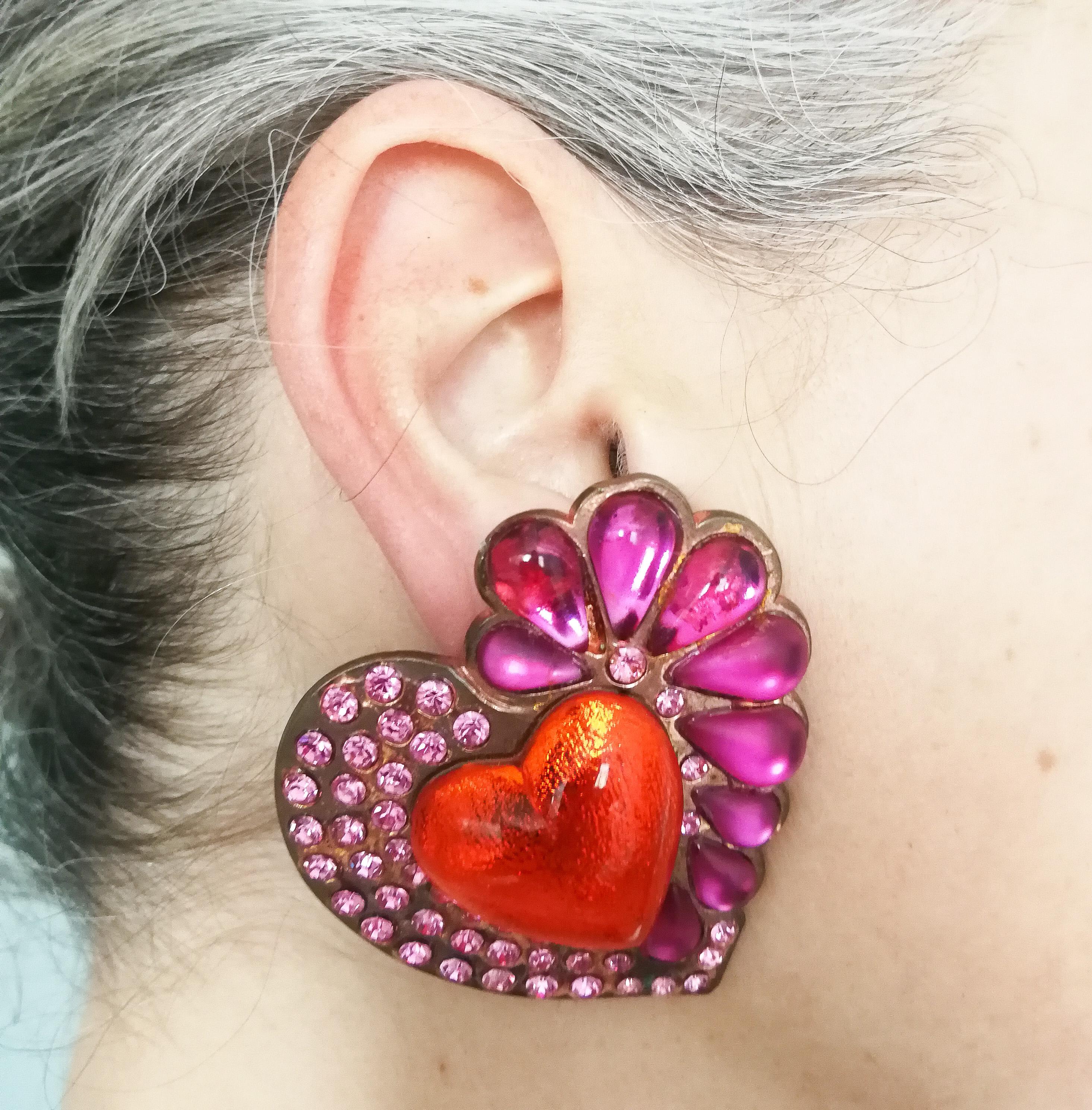 Truly magnificent, fabulous and over sized 'heart' earrings, in vibrant and dynamic shades of shocking pink and orange. Frosted, clear and foiled stones, of varying shapes and size, unique to these earrings, create a sumptuous combination. Truly