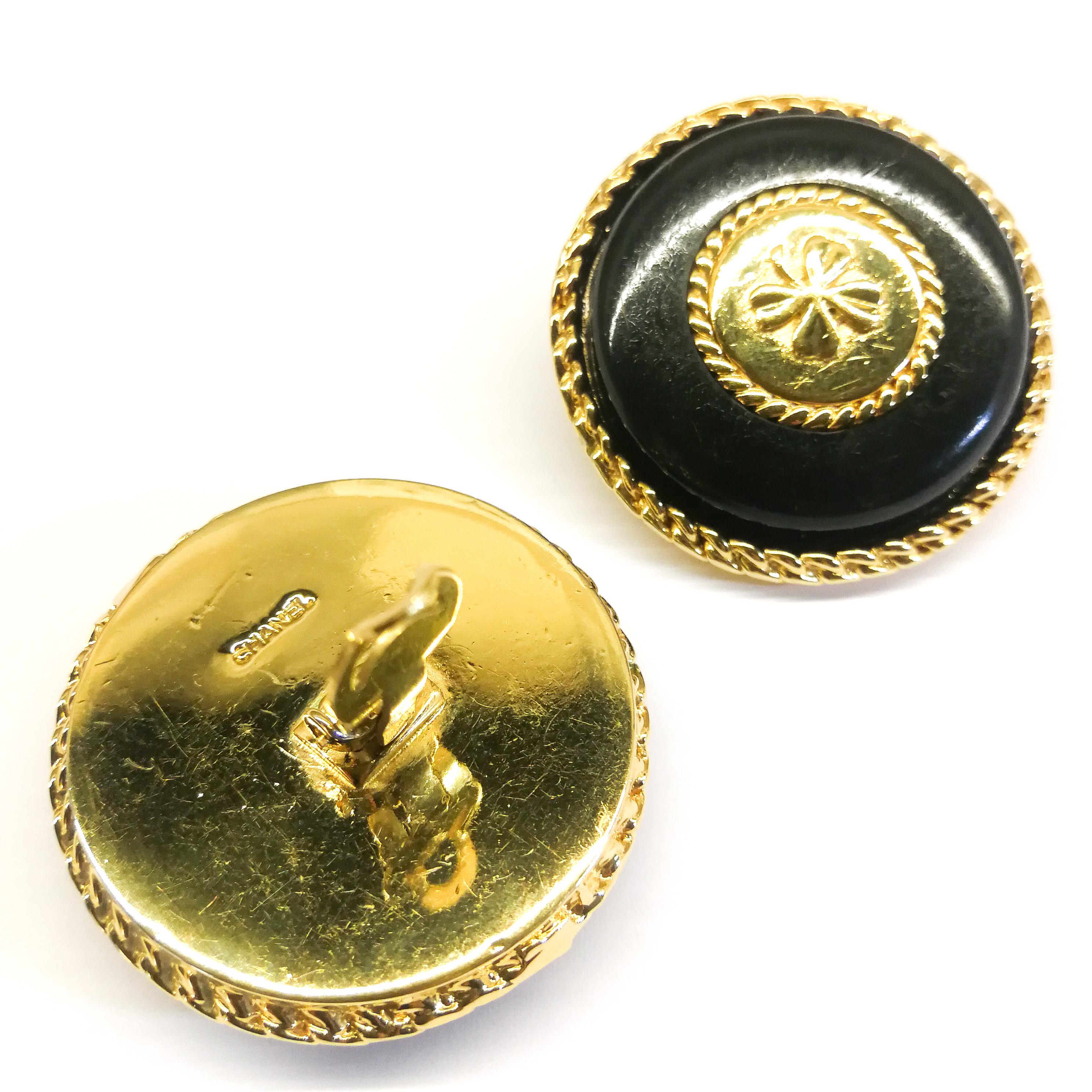 Classic and very smart , these black and gilt earrings bear the iconic motif of the lucky four leaf clover, one of Coco Chanel's personal talismans (the lion's head, Leo, the double C being others). With plaited gilt 'braid' as edging, reminiscent