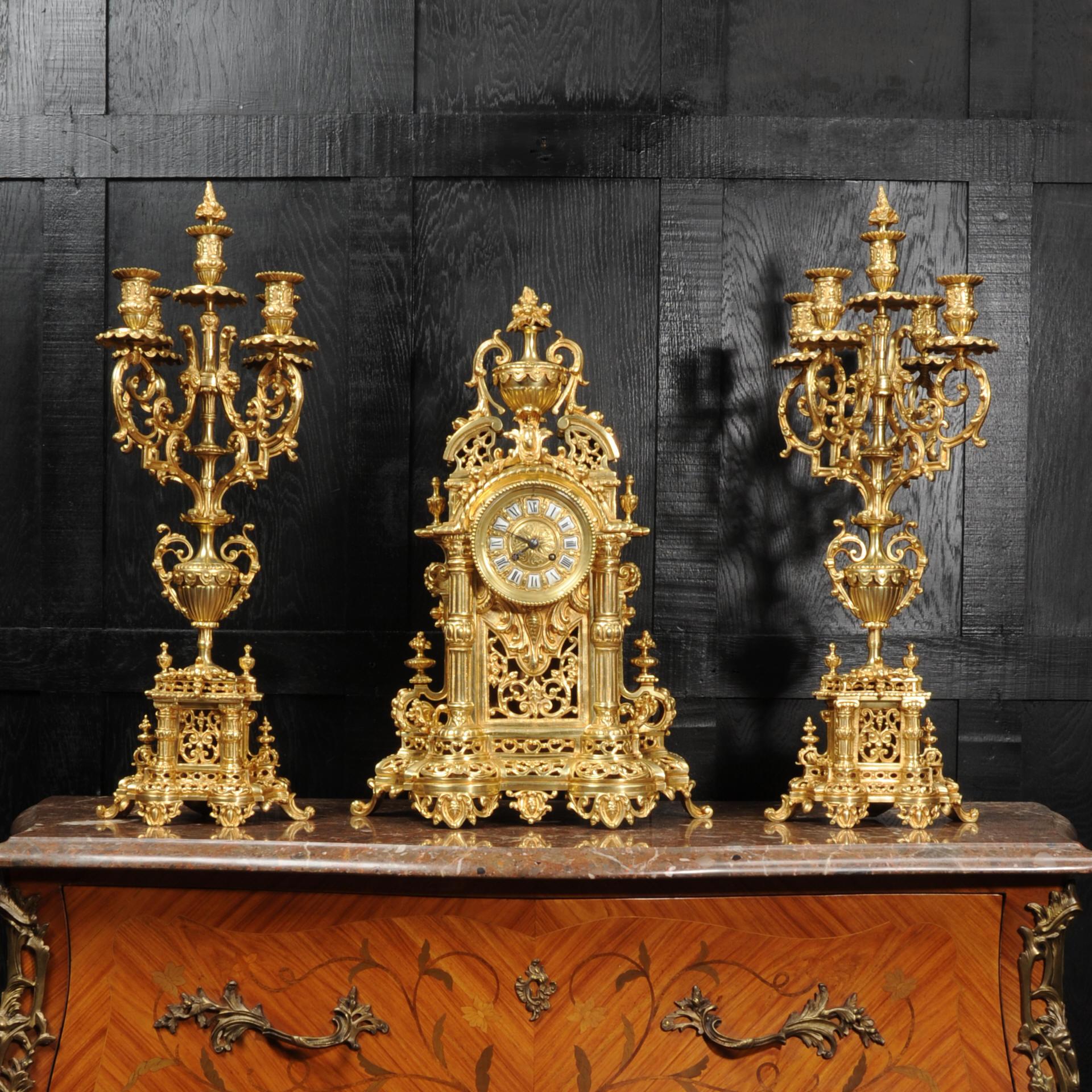 A huge original antique French Baroque clock set dating from circa 1880. Beautifully and substantially modelled, and finished with a lovely original gild. It is of architectural form with a swans neck pediment surmounted by an urn with an final of