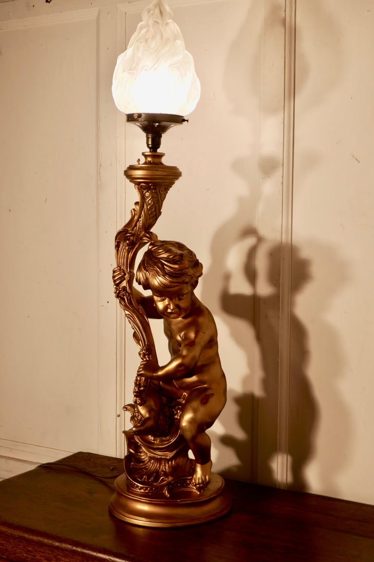 Huge Gilt Table Lamp in the form of a Cherub or Putti For Sale at