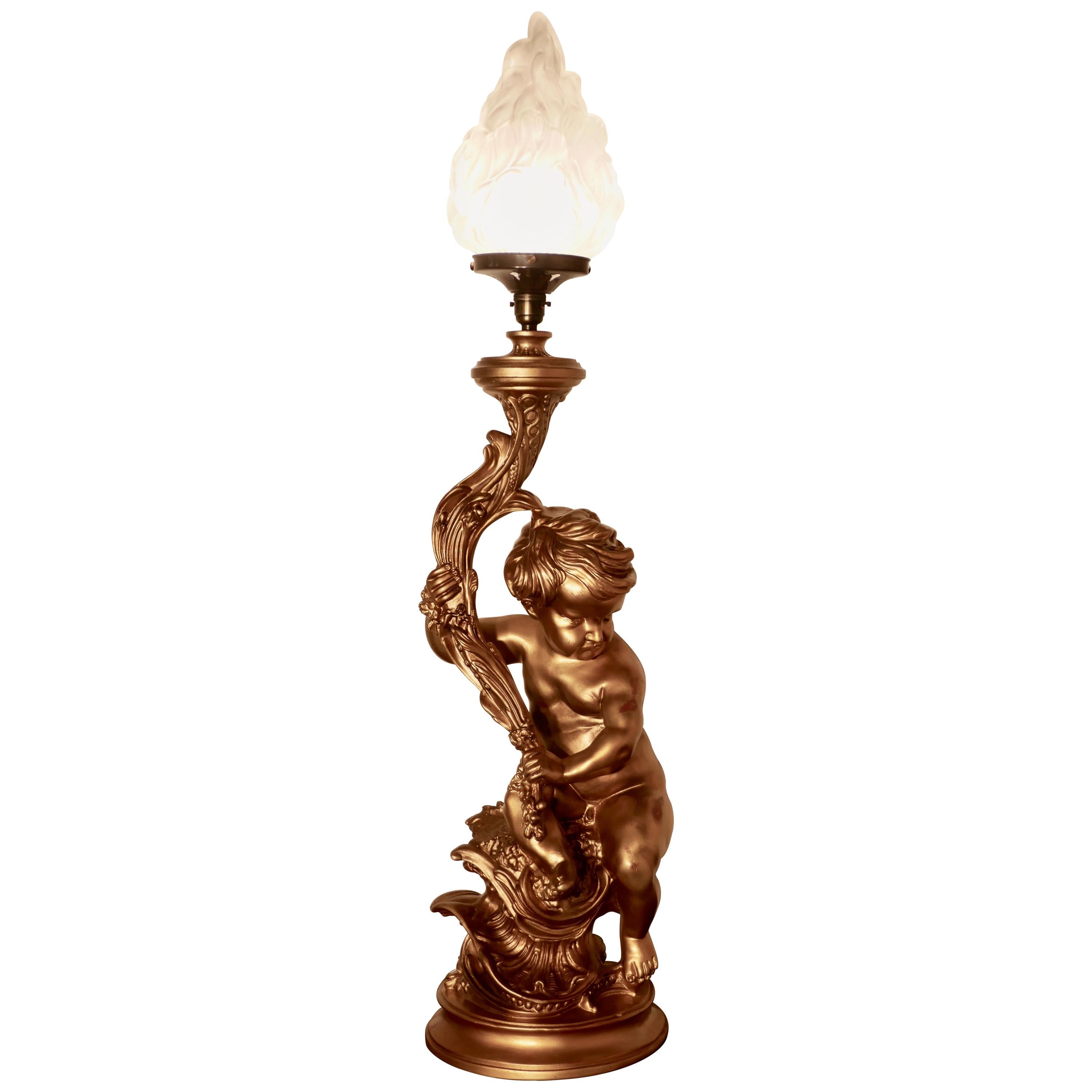 Huge Gilt Table Lamp in the form of a Cherub or Putti For Sale